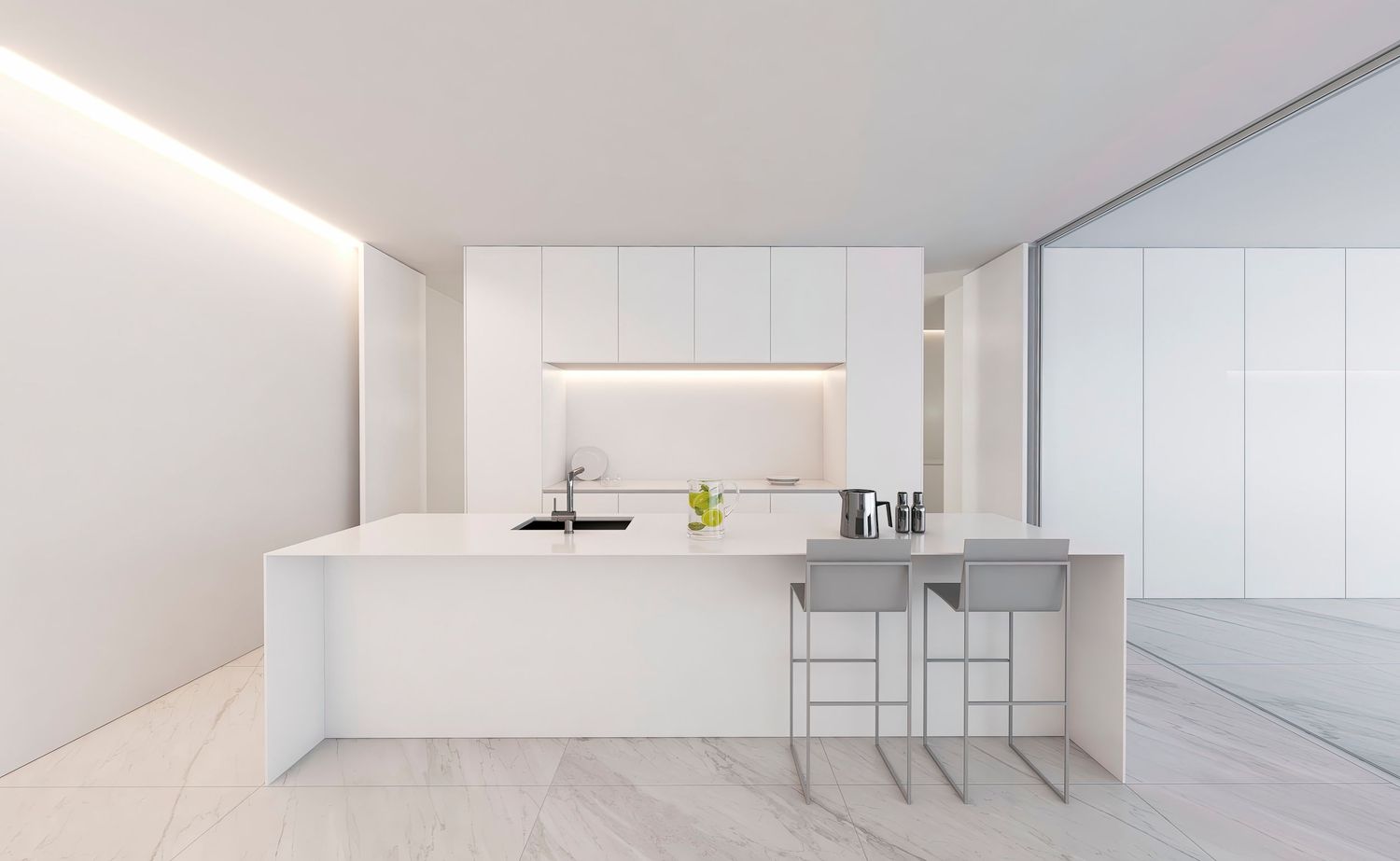 Contemporary all-white kitchen featuring minimalist island design and sleek bar seating.