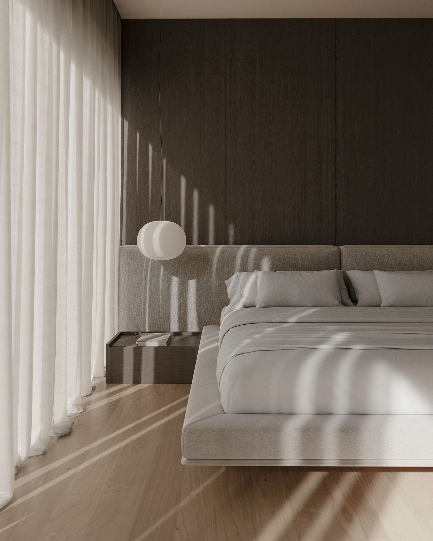 Modern minimalist bedroom with sunlight casting dramatic shadows through sheer white curtains onto gray walls.