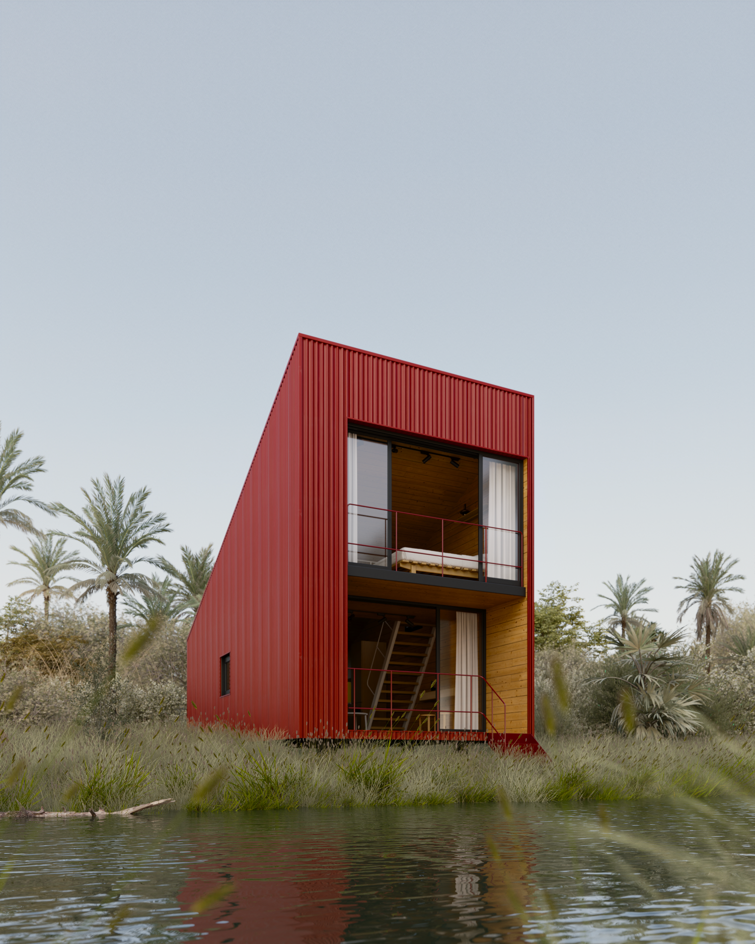 Contemporary red modular home with glass windows stands elevated near a serene waterfront.