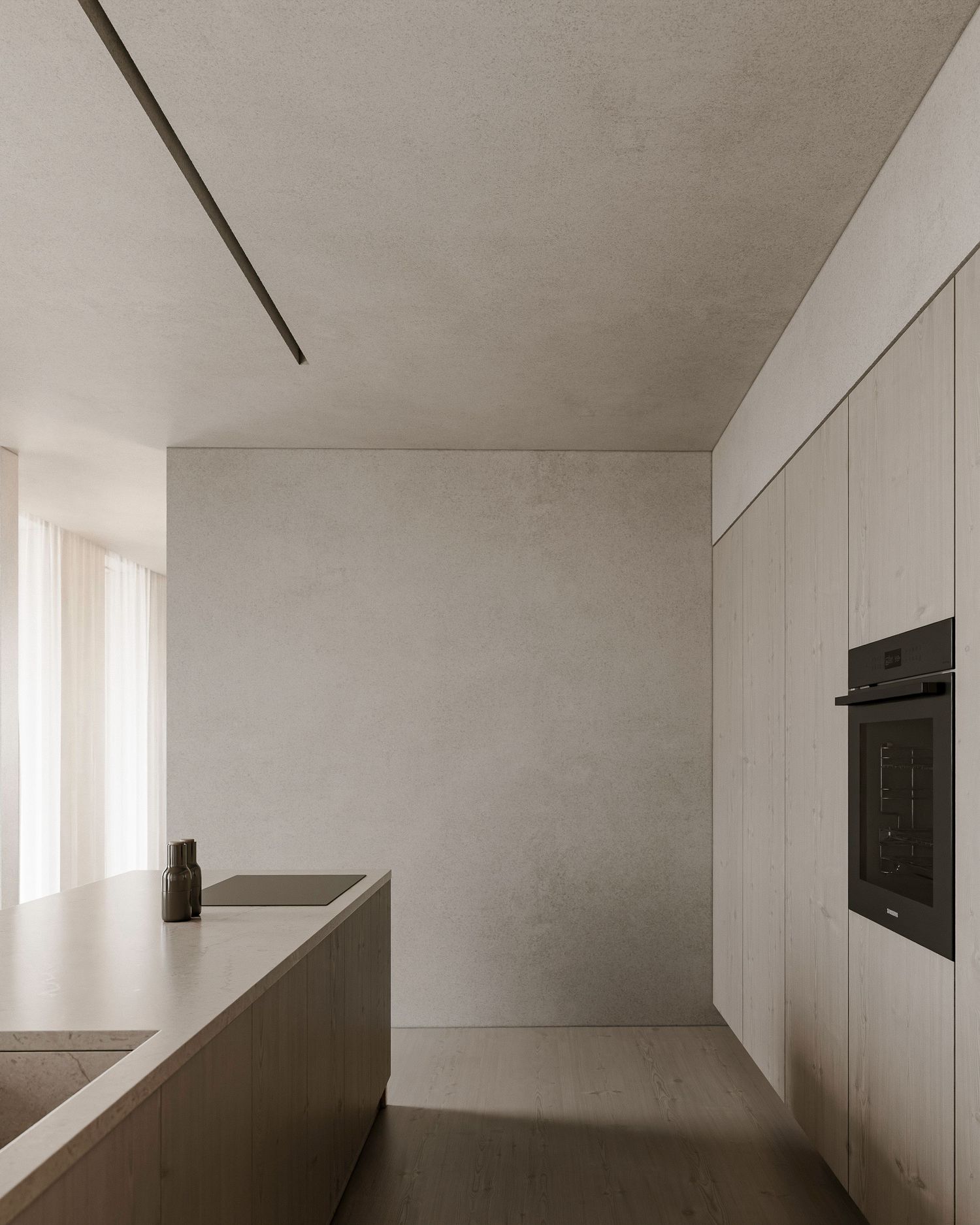 Minimalist white kitchen interior with built-in appliances and a sleek island counter in monochromatic design.