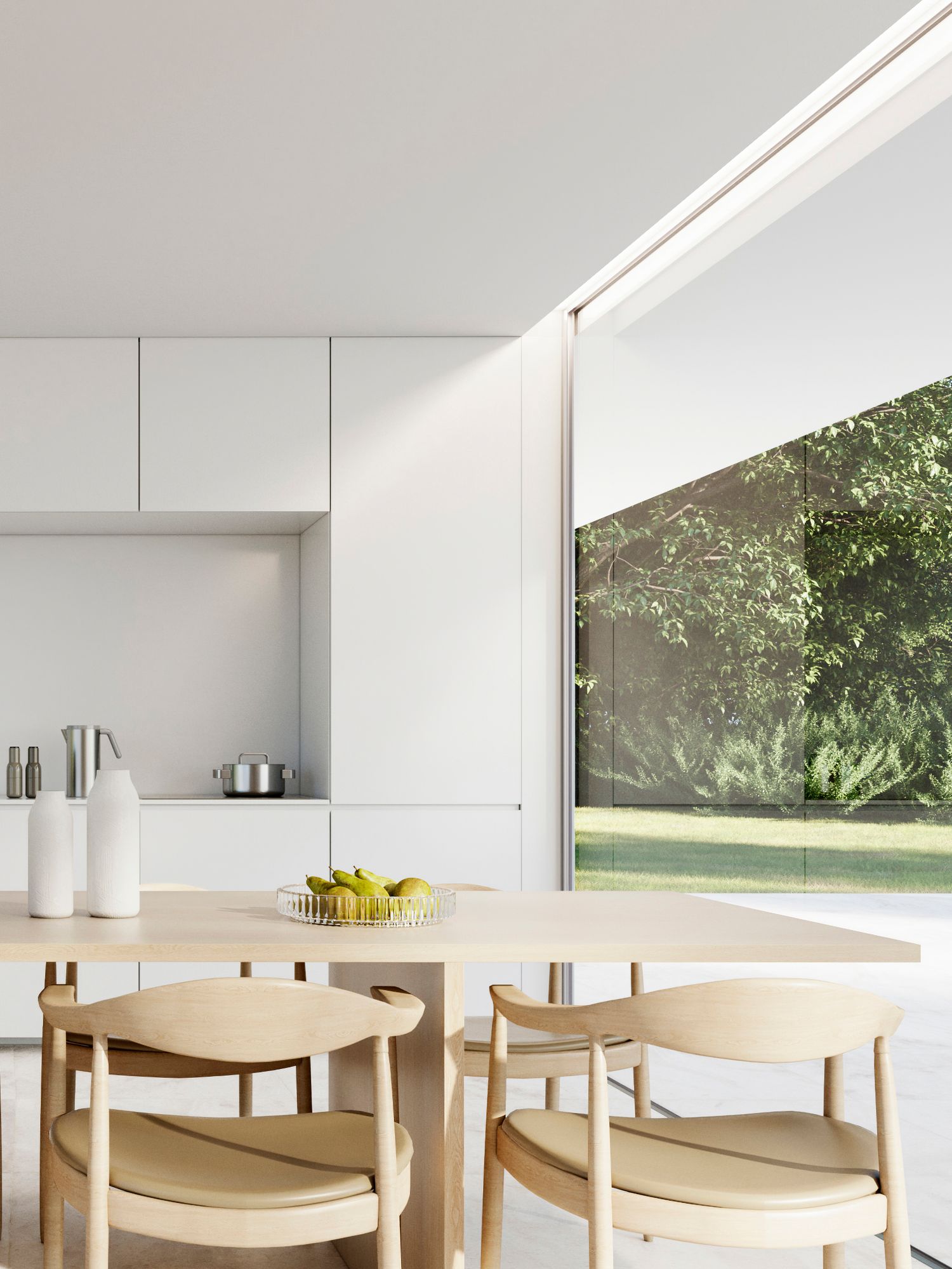 Modern minimalist dining area with light wood chairs and a large window overlooking a lush green garden landscape.