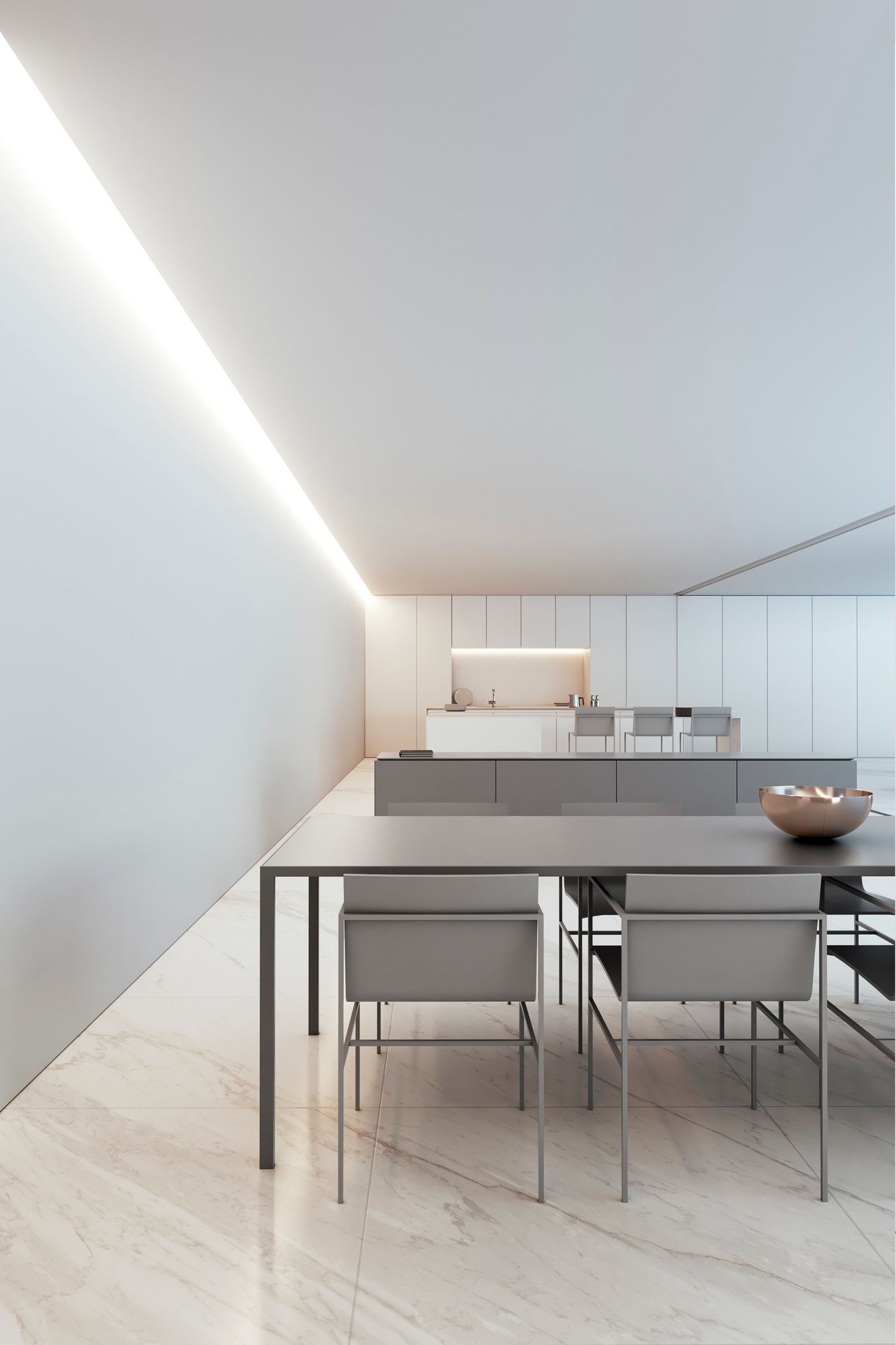 Modern dining area with grey chairs and table against pure white walls and linear ceiling lighting.