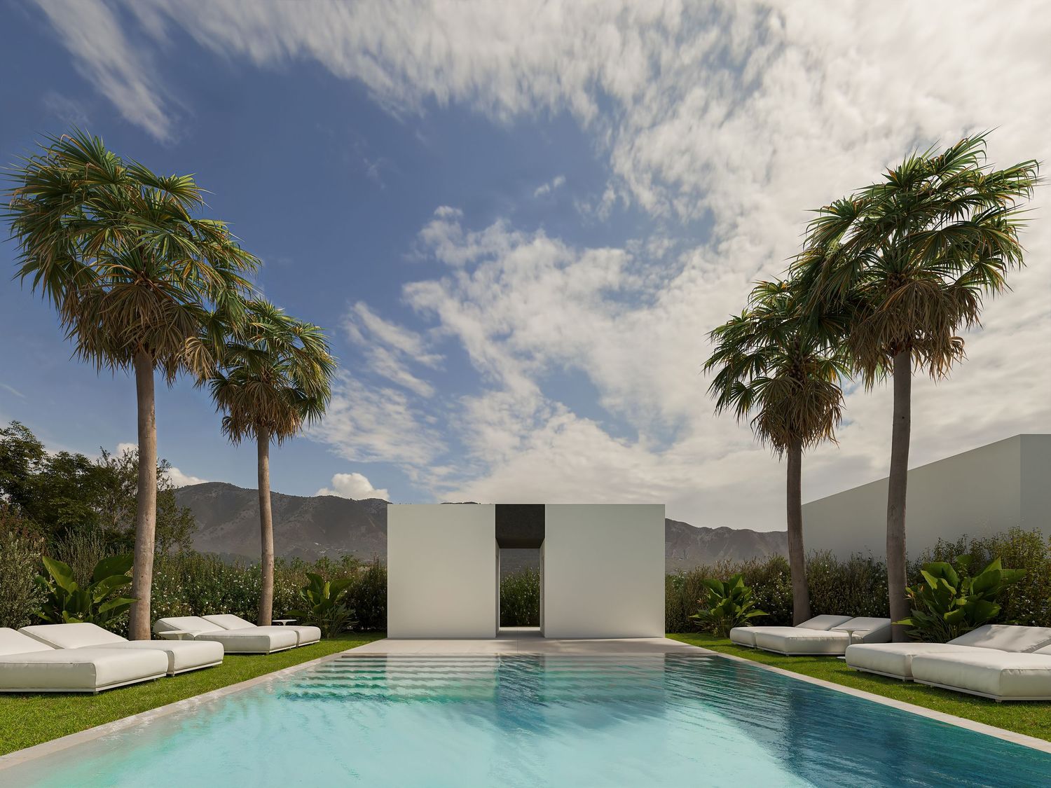 A modern infinity pool with palm trees and mountain views stretches along a sleek white building under blue skies.