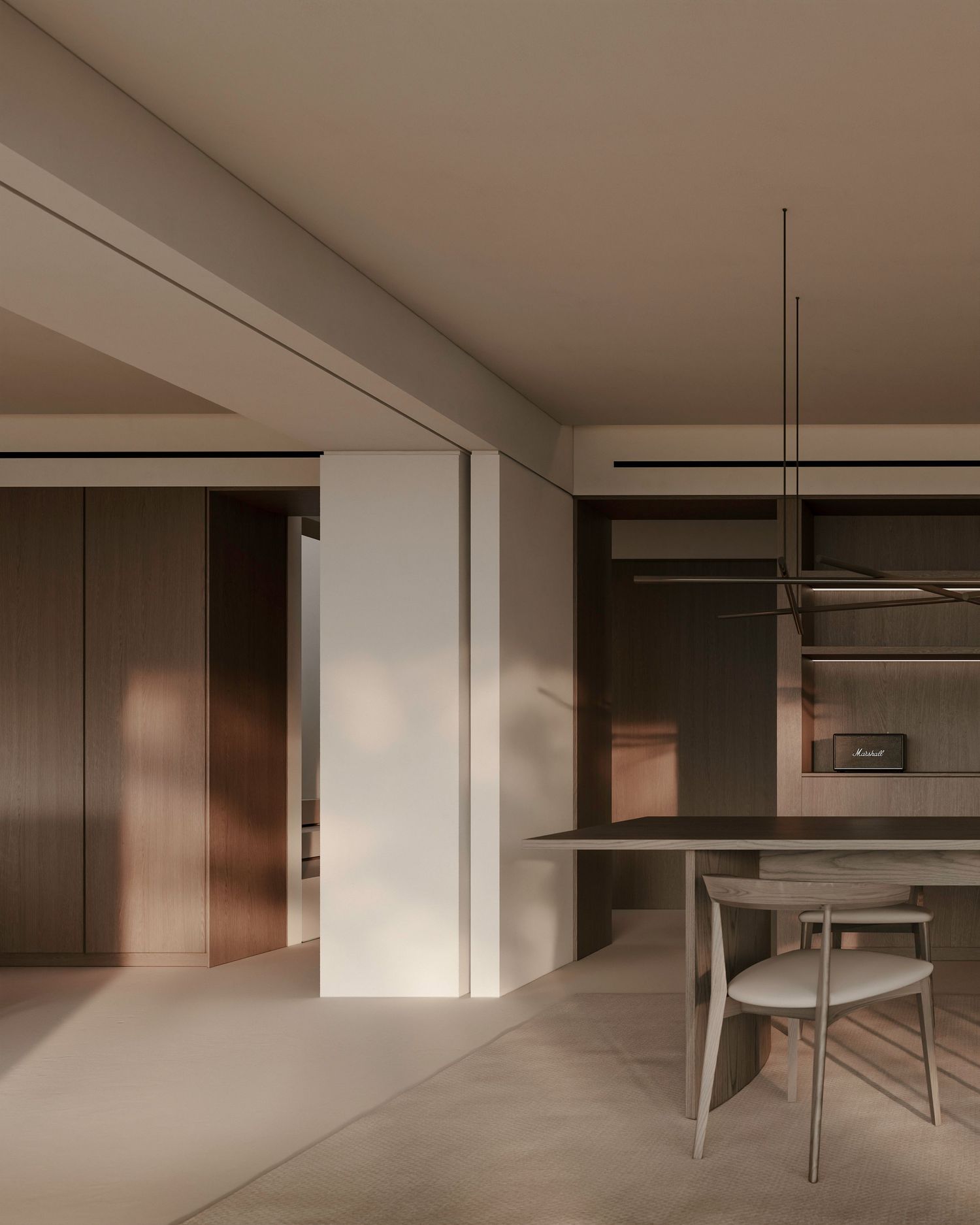 Modern minimalist interior with beige and brown tones featuring a dining area and sleek architectural details.