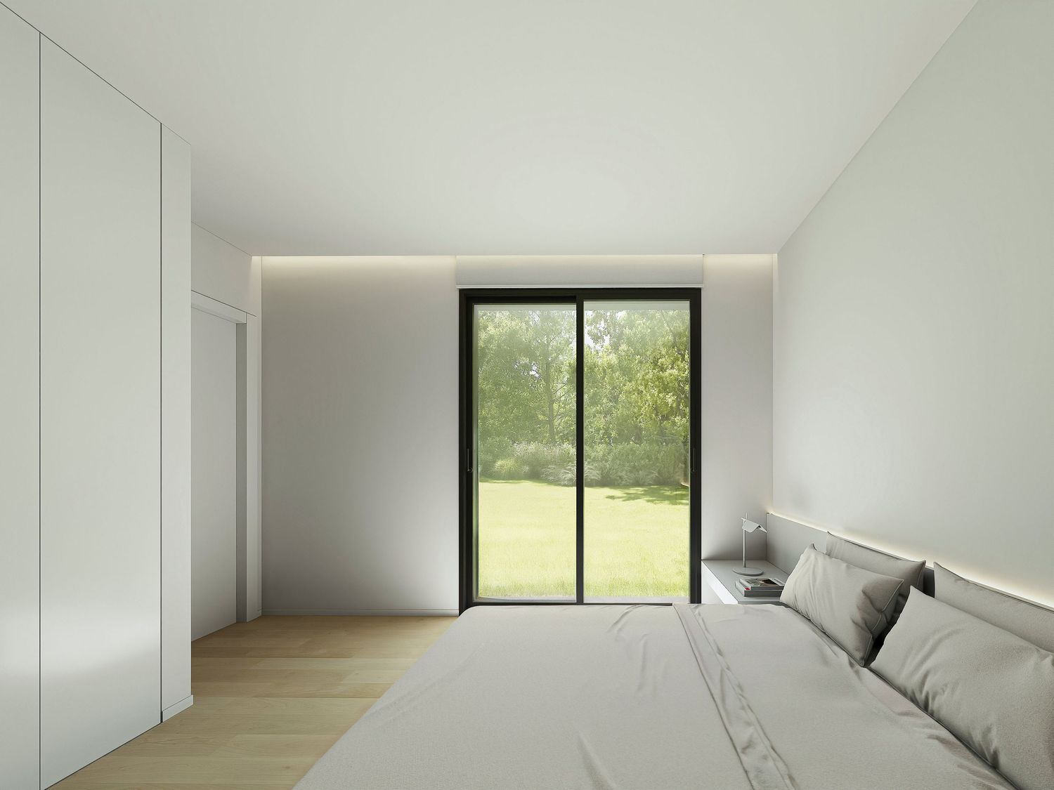 Contemporary room with white walls, built-in closets and window overlooking green landscape.
