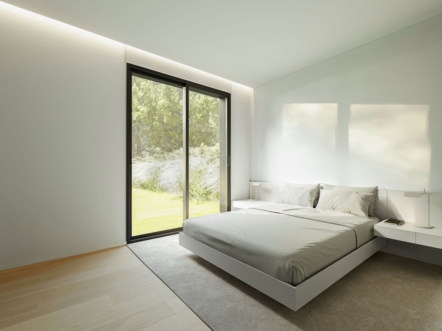 Minimalist white bedroom design with floor-to-ceiling windows and natural light flooding the contemporary space.