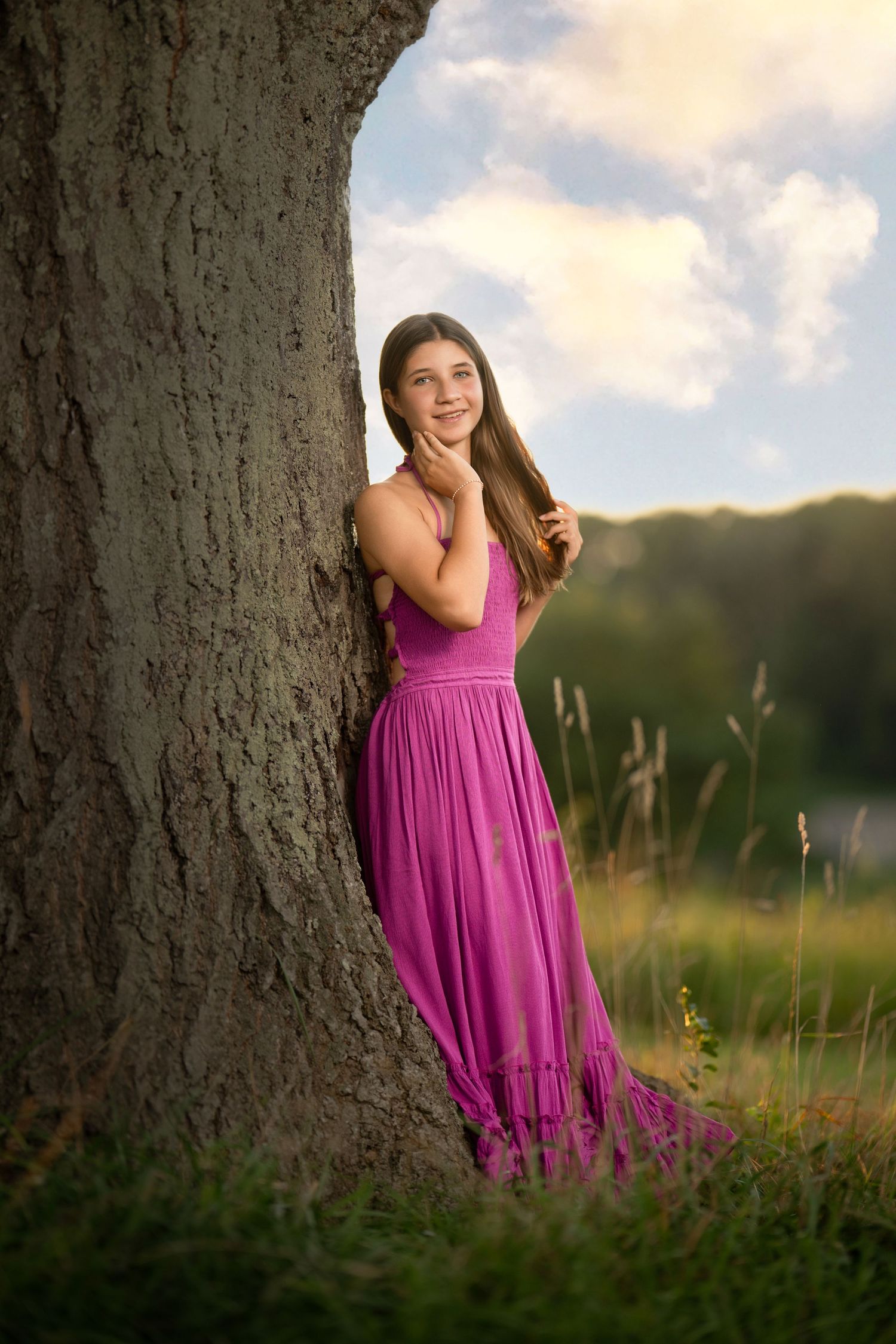 High school senior posing by a large tree during an outdoor senior  photography session near Wayne, PA.