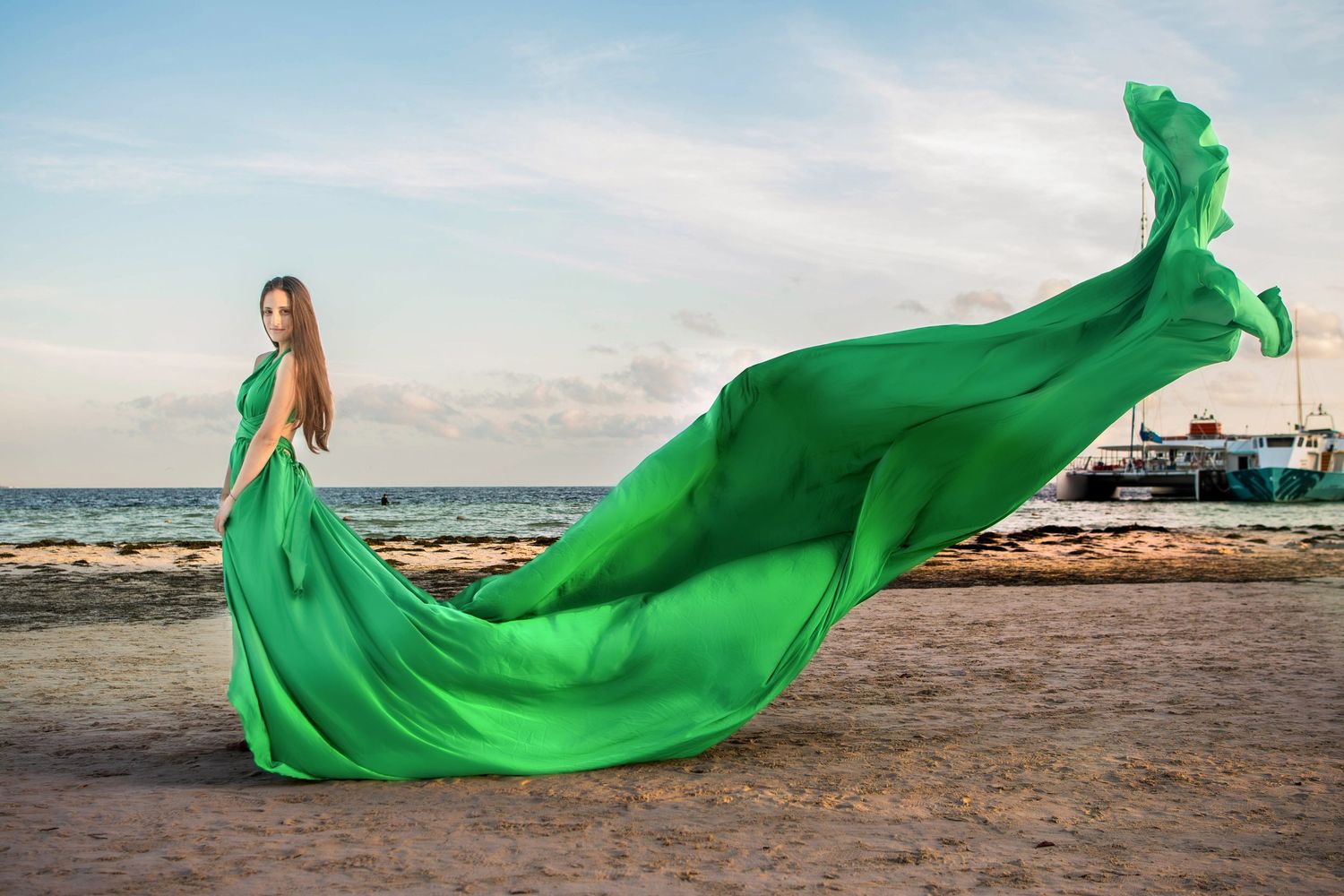 Green flying luxury photo session with satin flying green dress on the beach Wayne PA