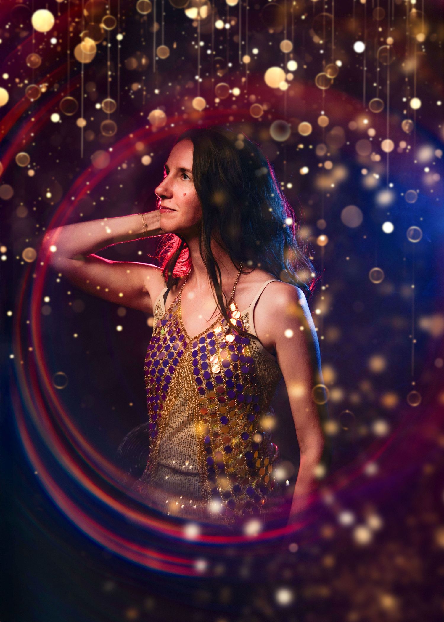A high school senior posing during her artistic glam portrait session.