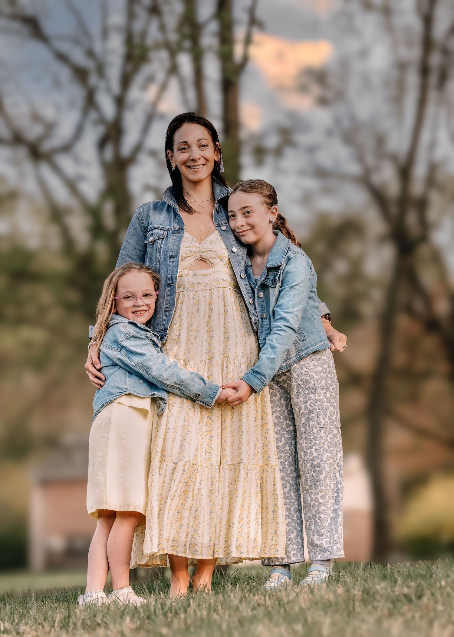 Mother with her two daughters during an outdoor Mommy & Me portrait session near Wayne, PA.