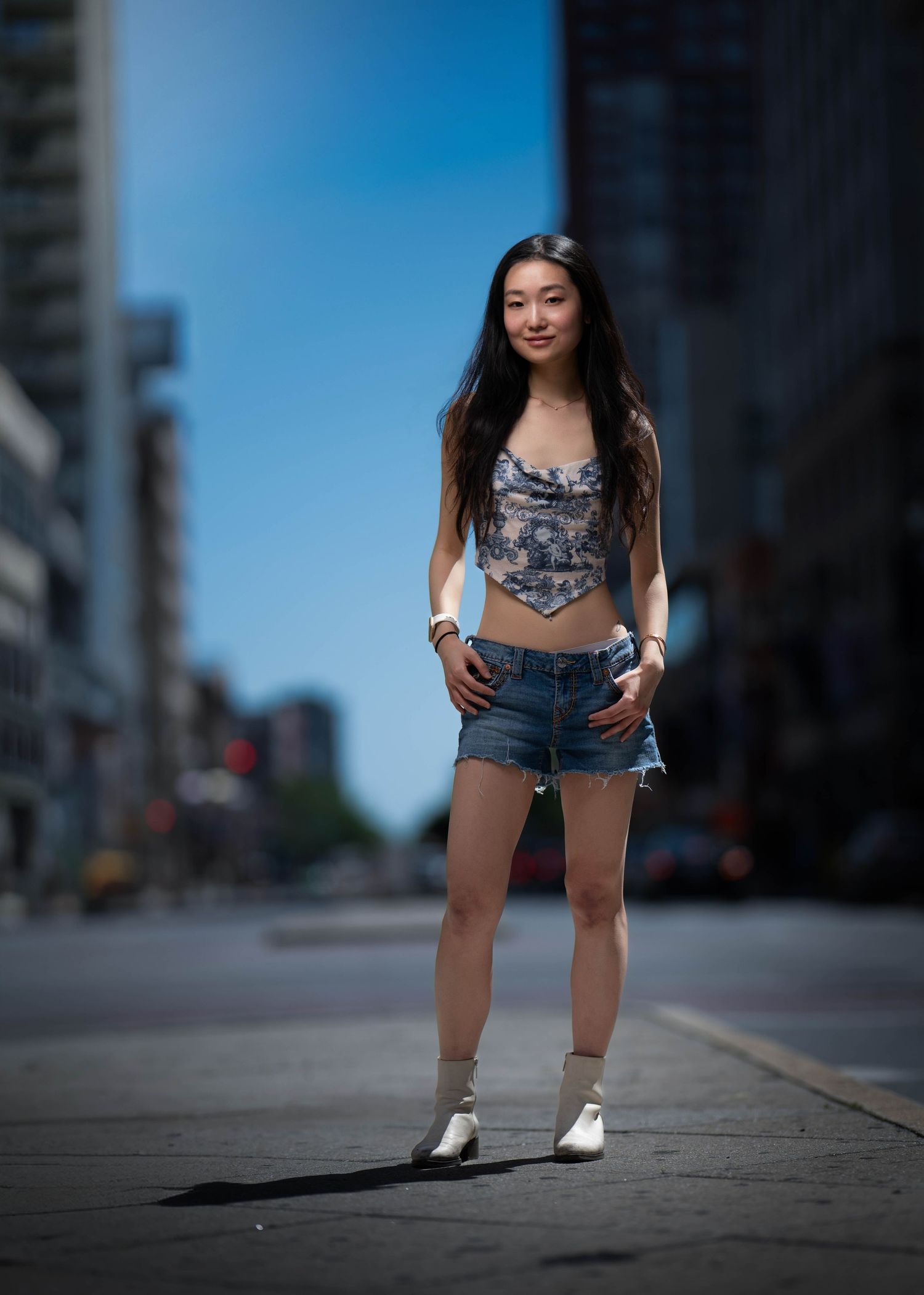 A high school senior during her dramatic portrait session outdoors.
