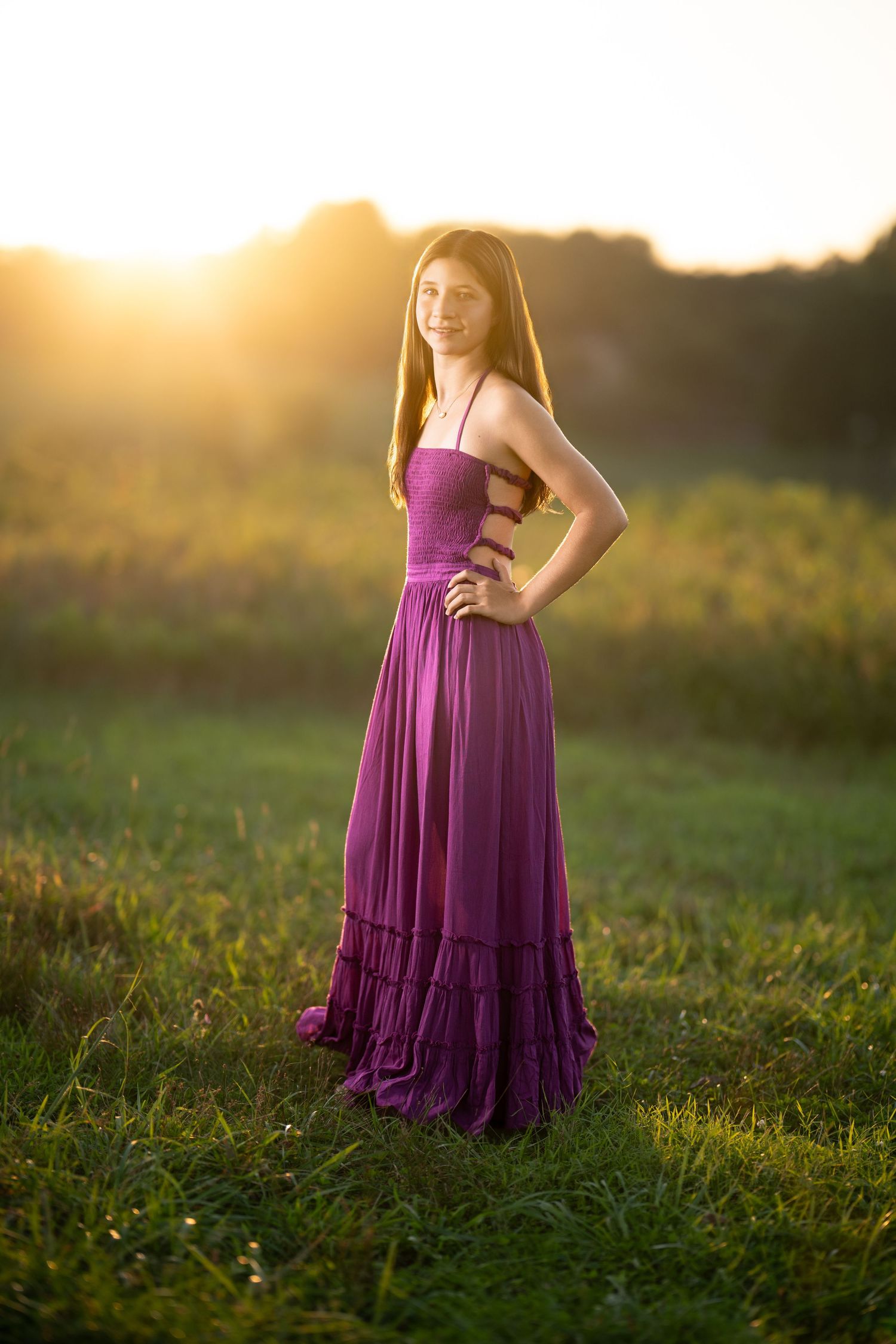 High school senior in a purple dress during an outdoor senior photography session near Wayne, PA.