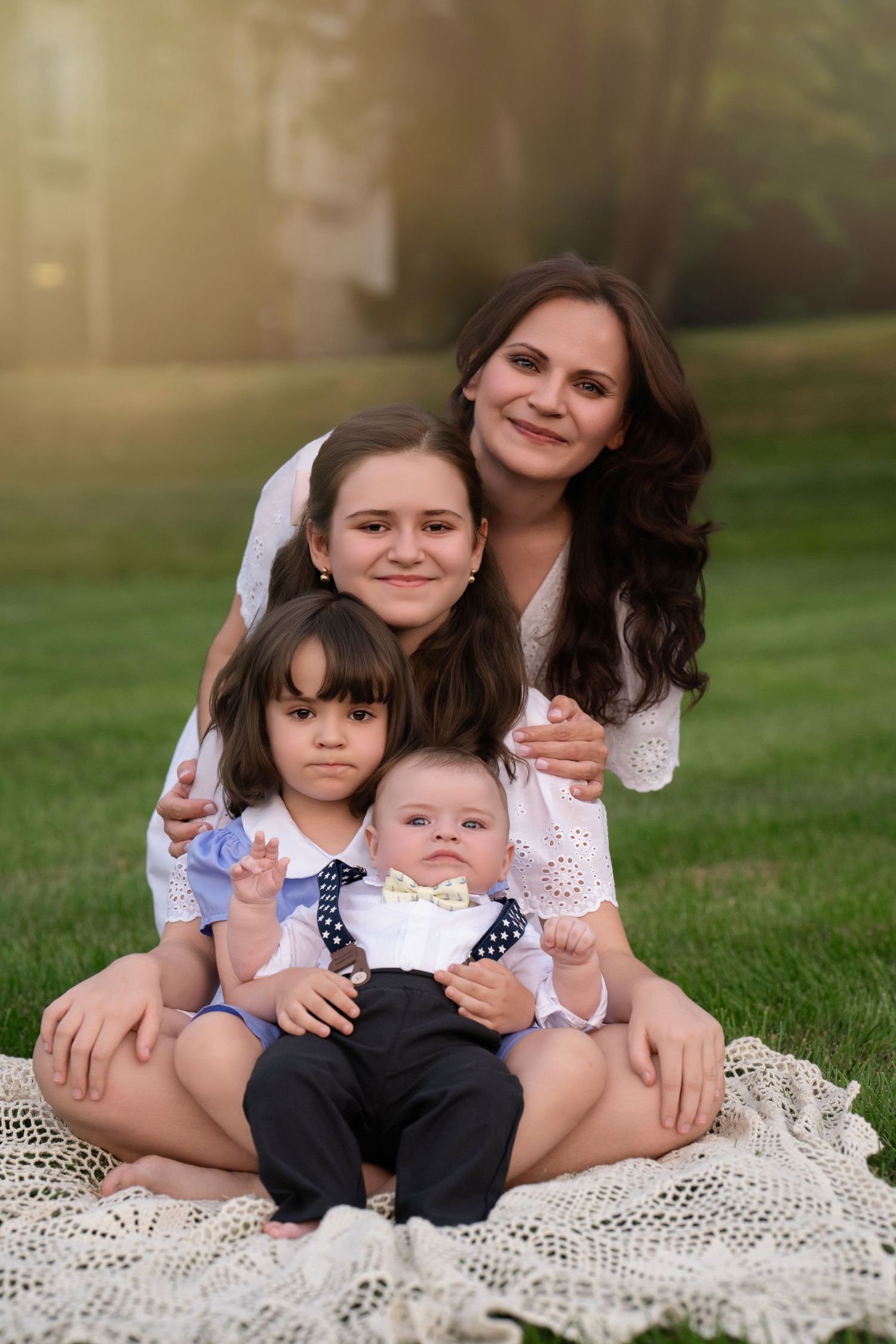 Mother with her three children during an outdoor Mommy & Me photography session near Wayne, Pennsylvania.