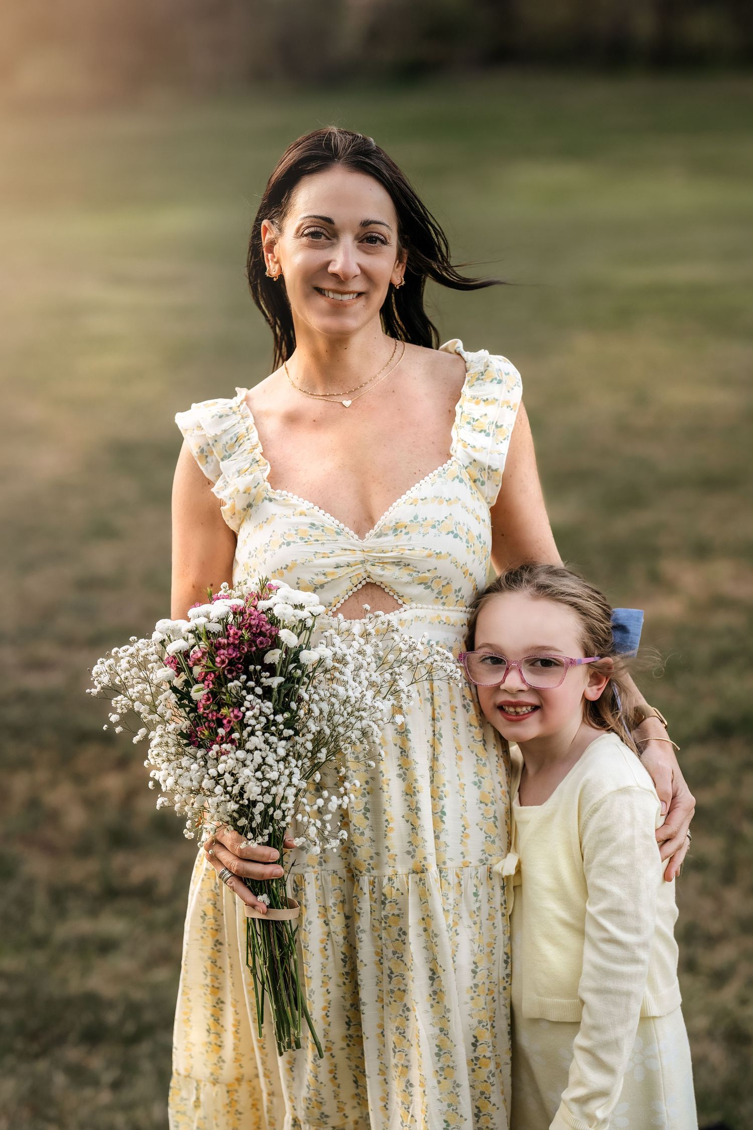 Mother and daughter portrait with wildflowers during a Mommy & Me photography session on the Main Line, PA.