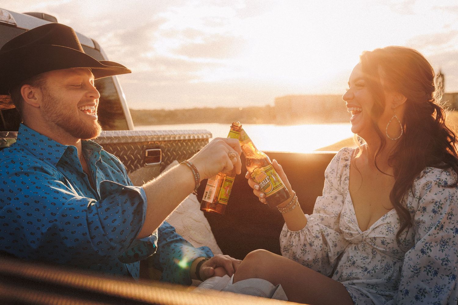 Couple enjoying drinks in a car during golden sunset with multiple candid moments shown across connected images.