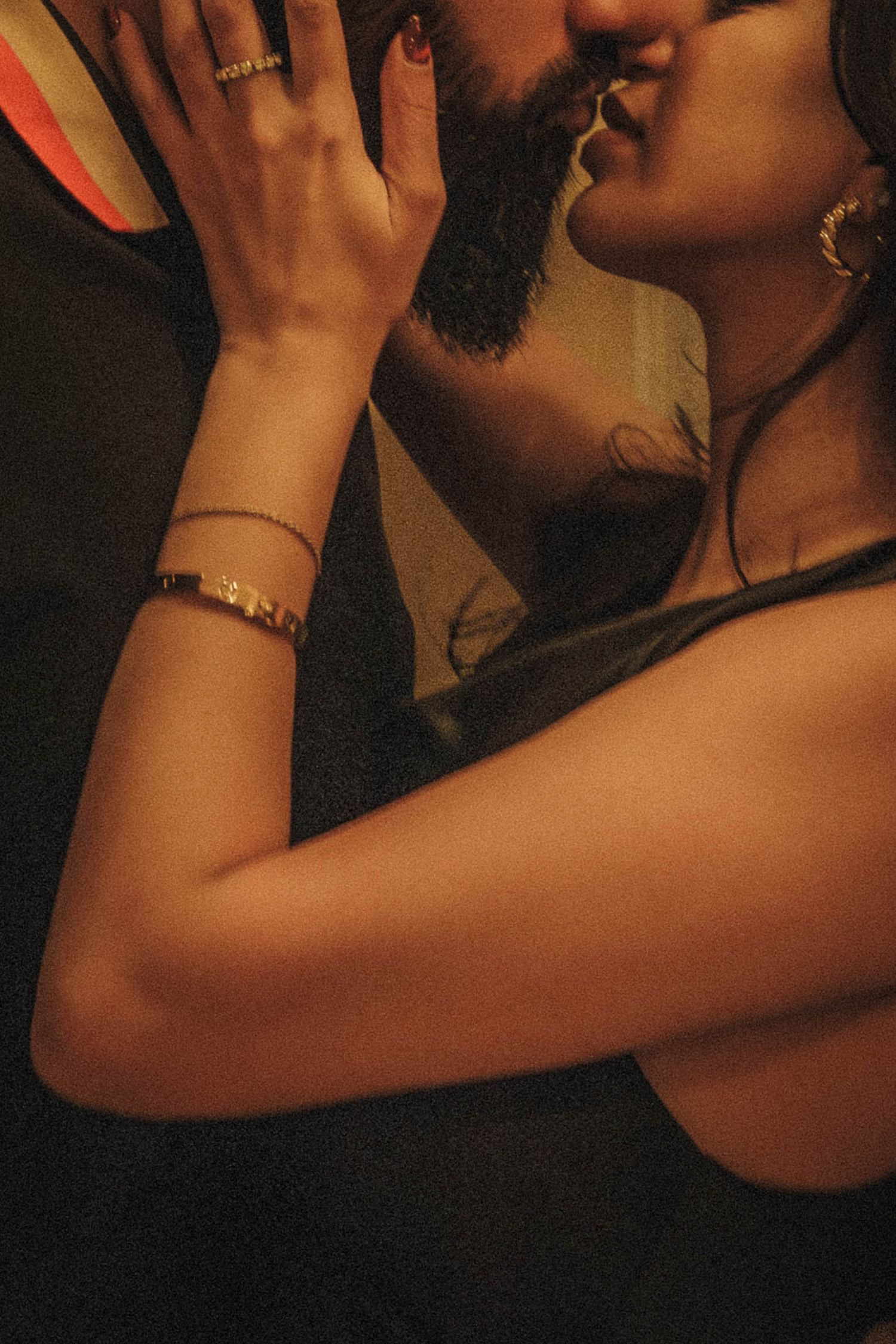 Artistic sequence showing hands and silhouettes in warm lighting against a dark background.