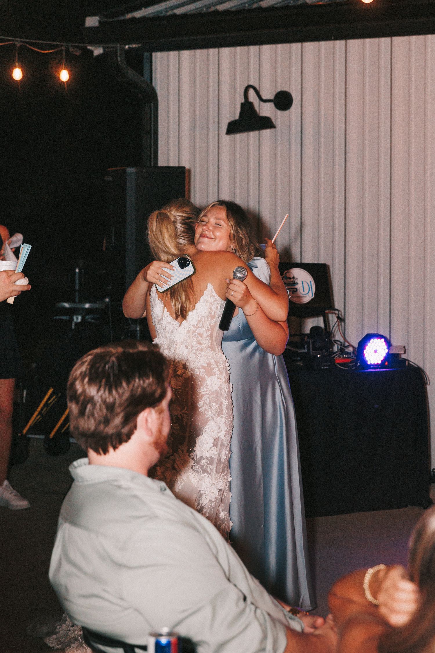 Wedding party dancing and celebrating during an evening reception.