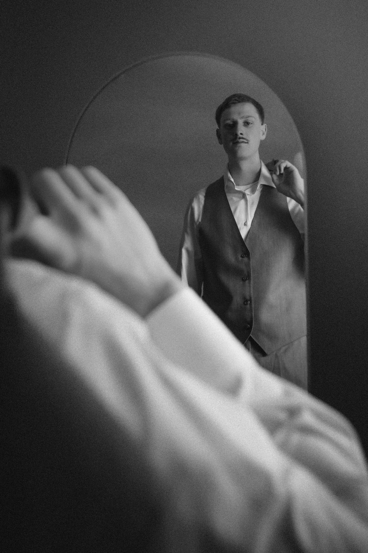 A dramatic black and white photo sequence showing feet in motion against a shadowy background with a mysterious figure.