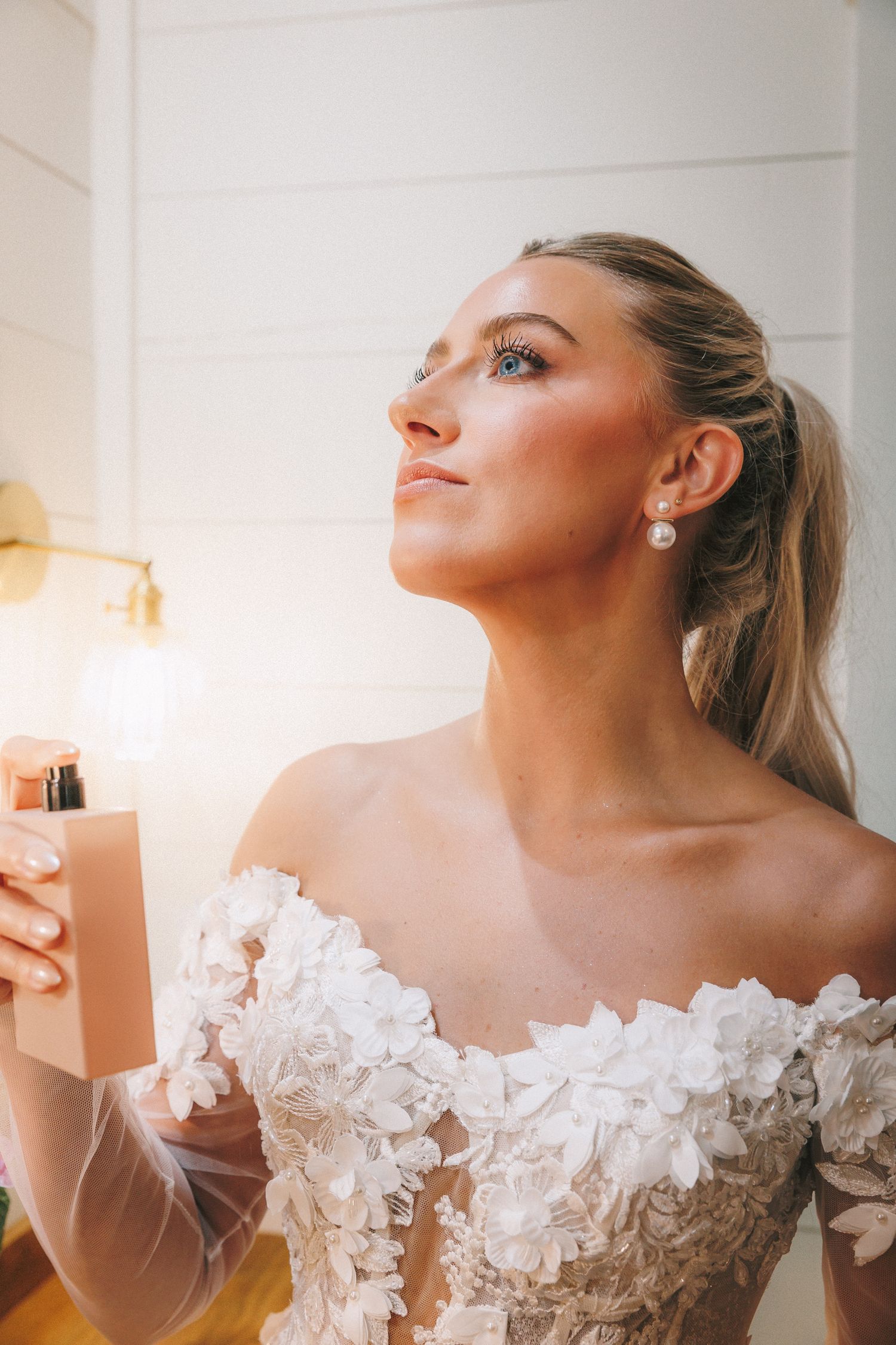 Wedding dress with delicate lace details photographed in soft, natural light.