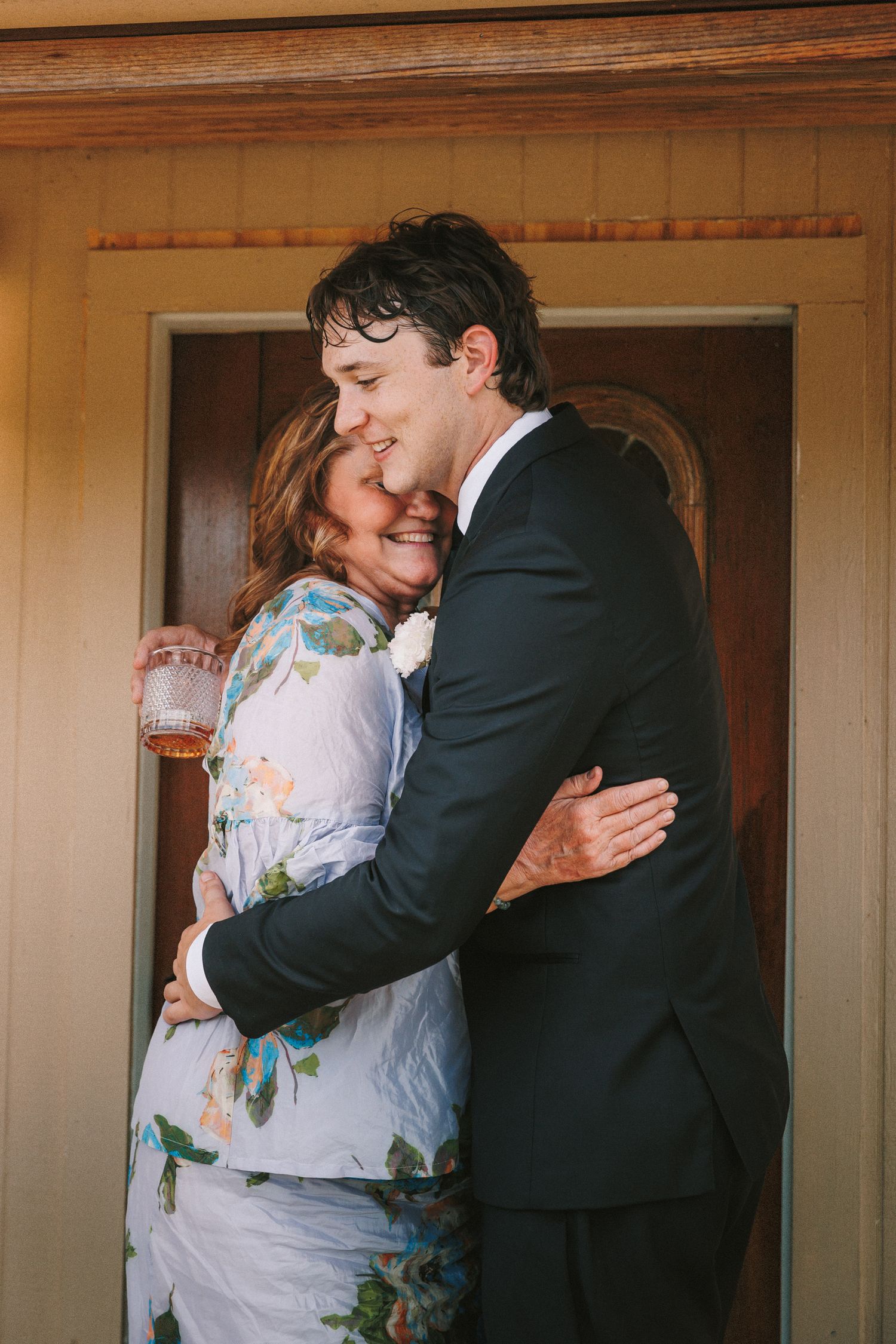 Candid sequence of a couple embracing and laughing in formal wedding attire.