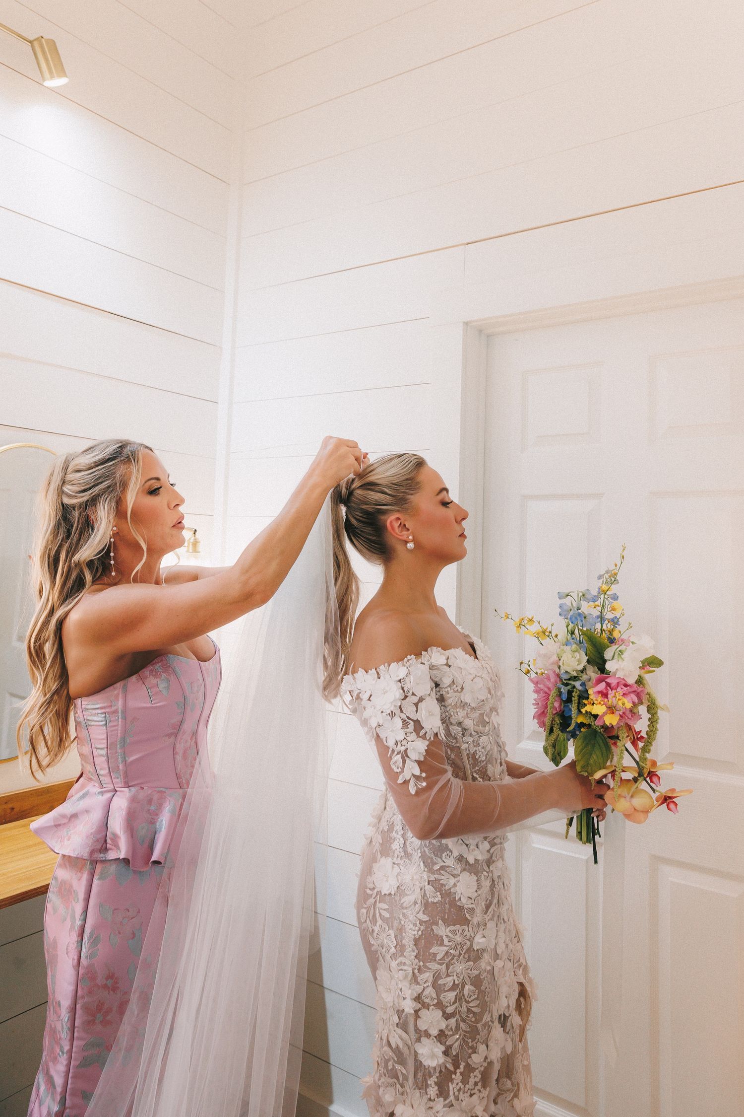 A series of getting ready moments showing a person in a pink dress and white veil preparing for a wedding.