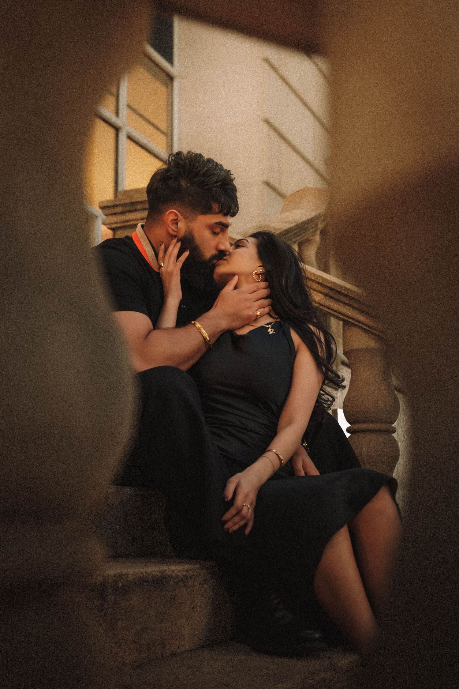 Intimate sequence of a couple sharing romantic moments in dim, atmospheric lighting.