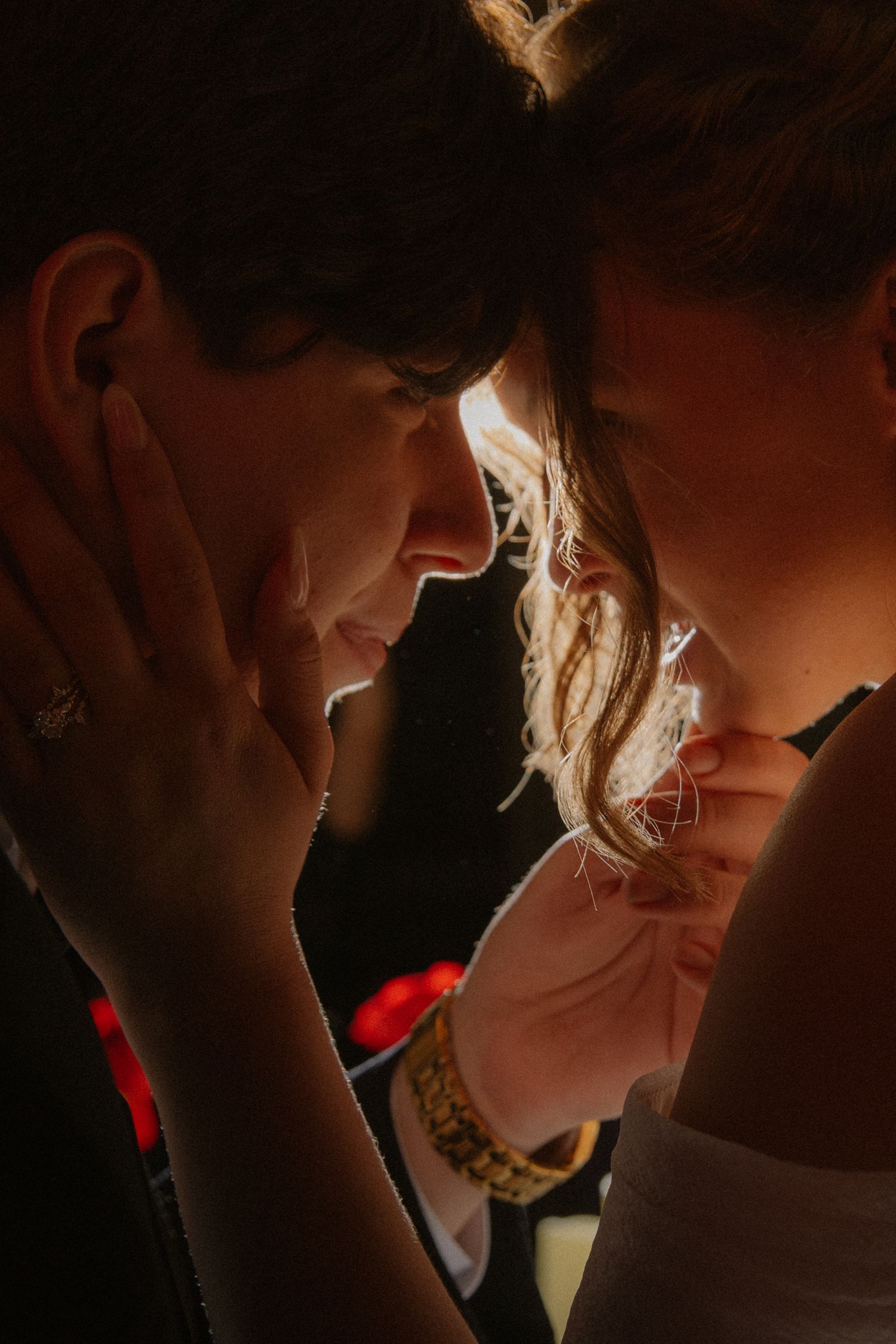Intimate close-up of bride and groom sharing a romantic moment at their wedding.