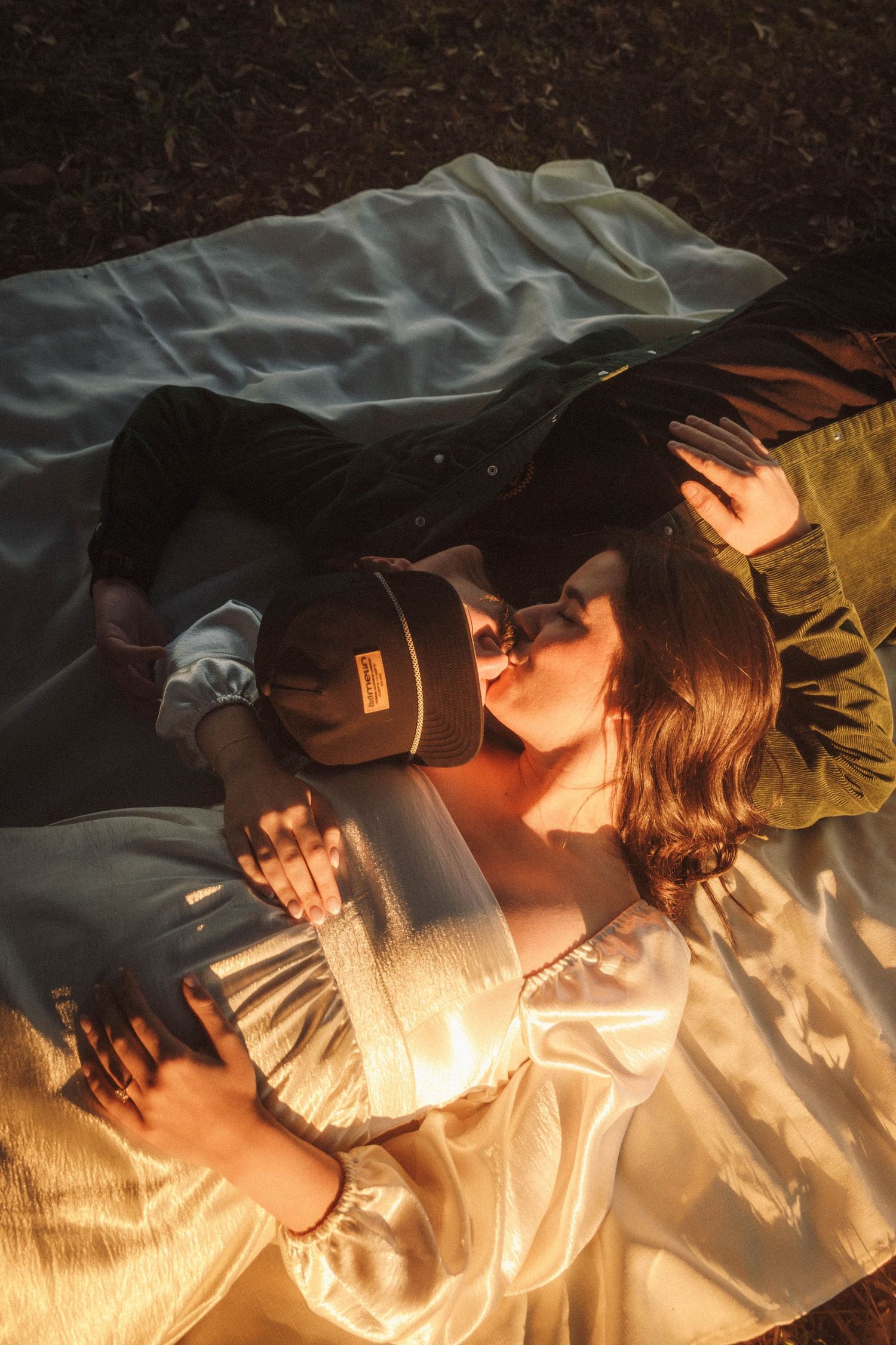 A person lying down in dim lighting photographed in a sequence of intimate close-up shots creating a dreamlike atmosphere.