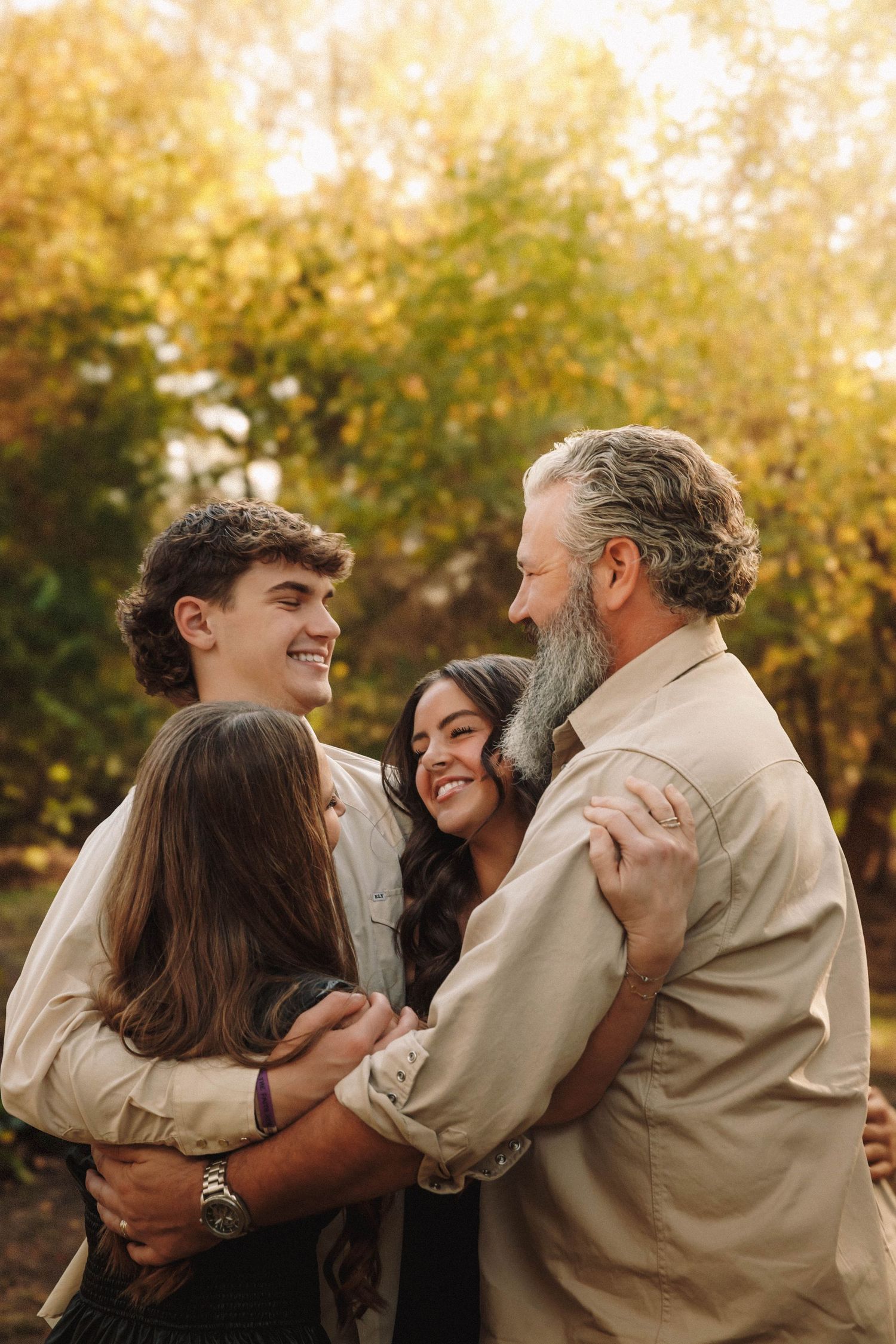 A playful series of candid family photos showing warm embraces and laughter in a golden autumn setting.