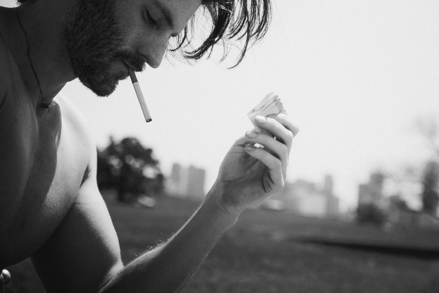 A black and white composite photo shows smokers taking drags from cigarettes in dramatic silhouettes.