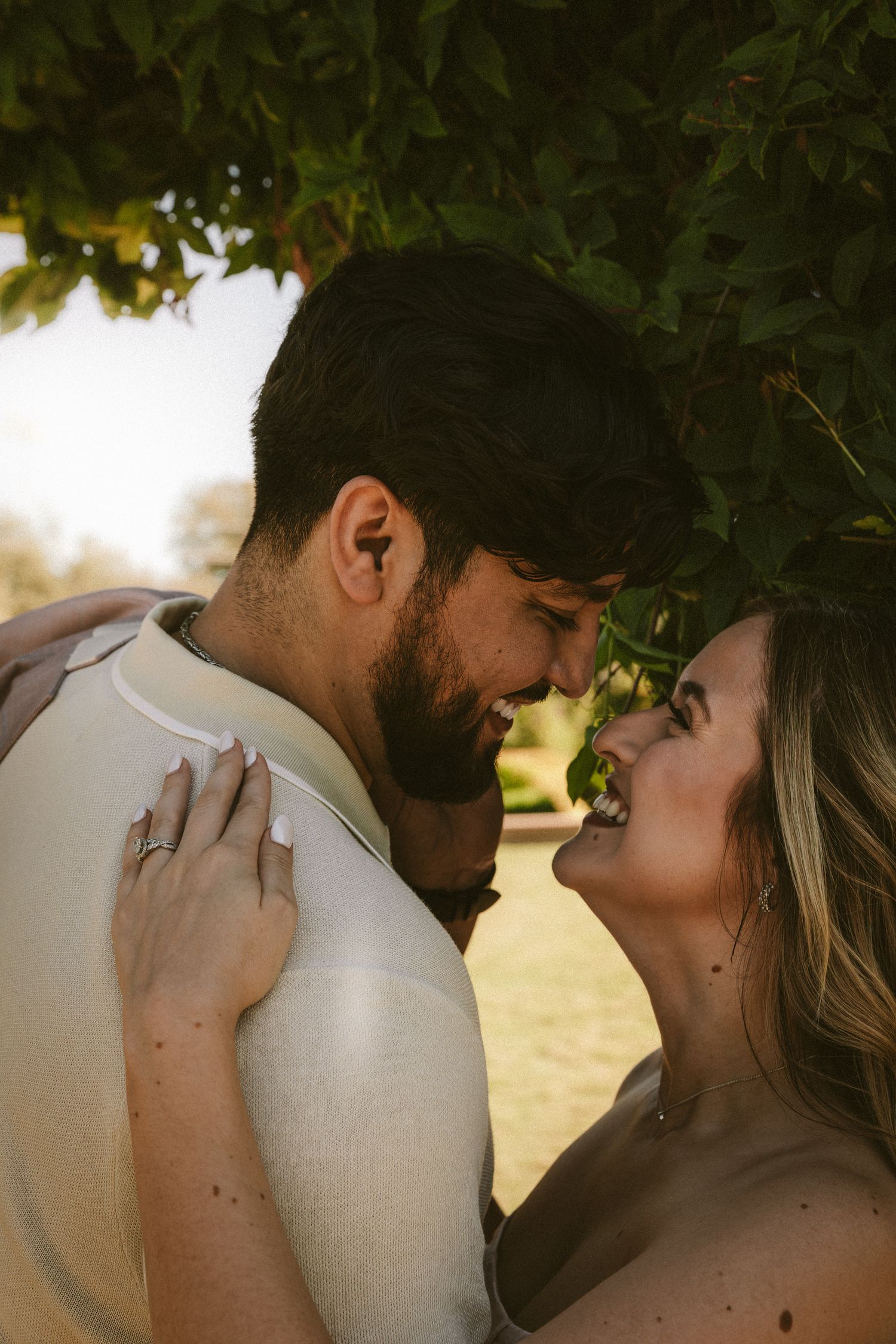 A romantic couple shares intimate moments in a series of close-up shots during golden hour.