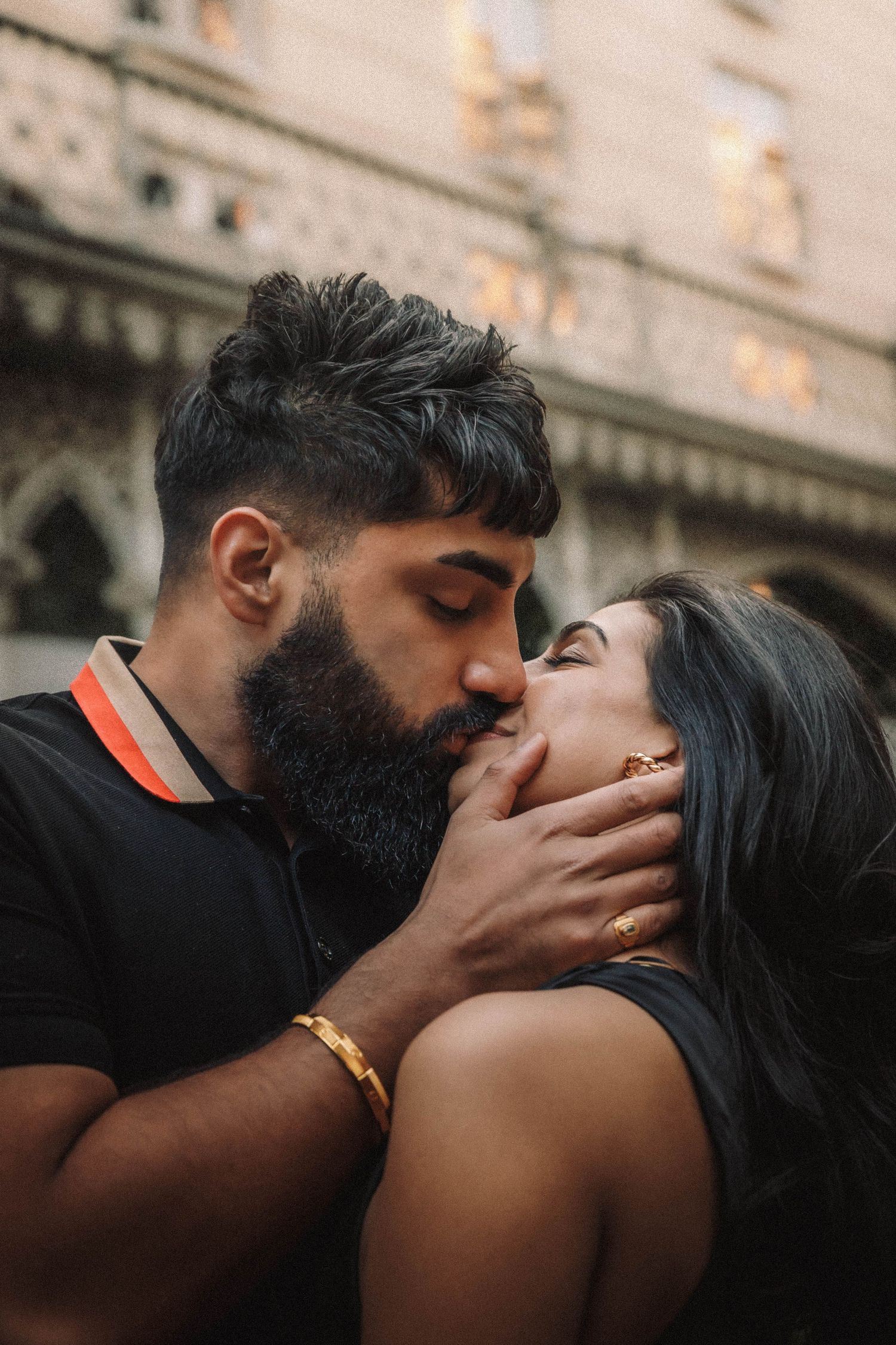 A couple shares romantic kisses in sequence under warm indoor lighting.