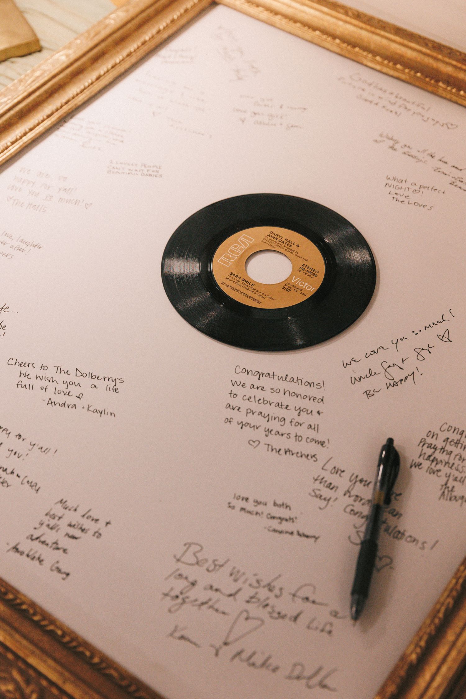 Vintage vinyl records and handwritten notes displayed artistically on paper with a pen.