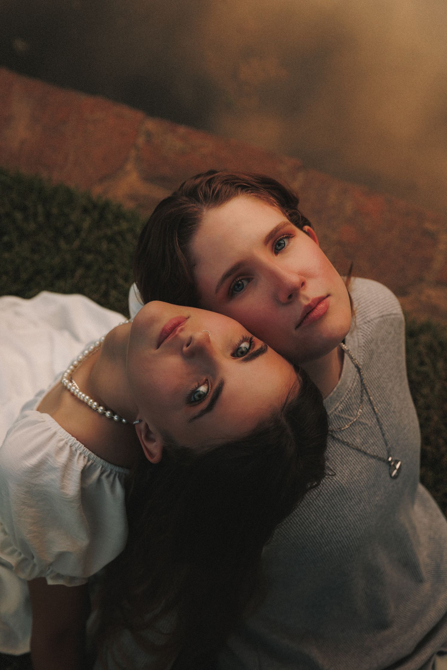 Artistic portrait series showing dramatic lighting and shadows against a warm-toned background.