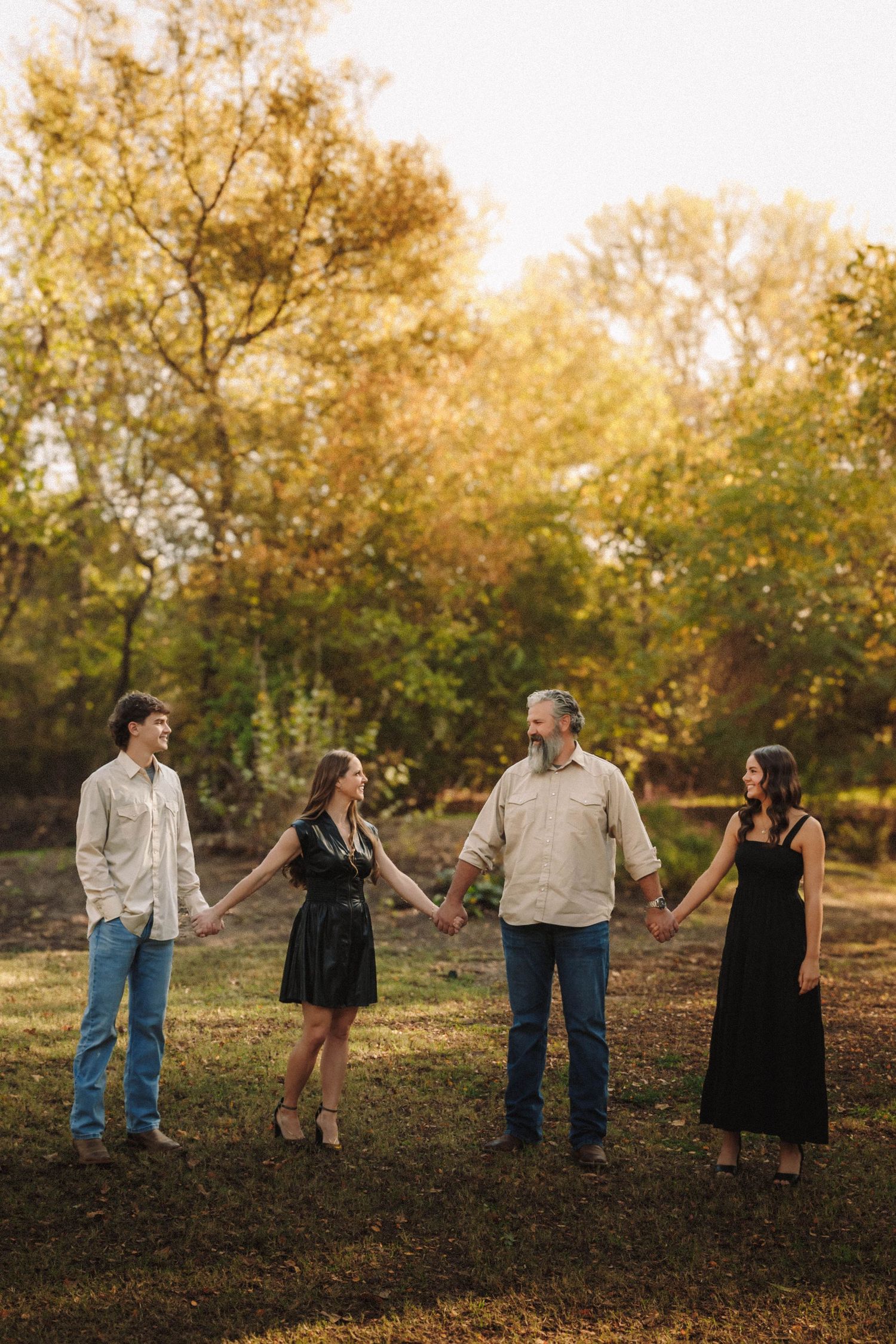 A sequence of romantic sunset photos shows a couple in casual attire interacting playfully against autumn trees.
