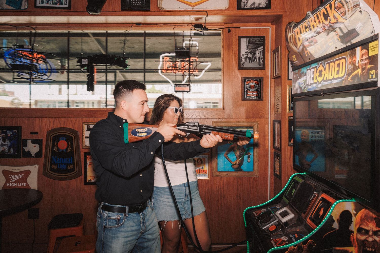A panoramic view inside a rustic pub or bar with wooden panels and vintage decorations on the walls.