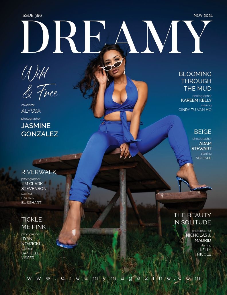 Fashion magazine cover featuring model in bright blue athletic wear and sunglasses posing on wooden structure outdoors.
