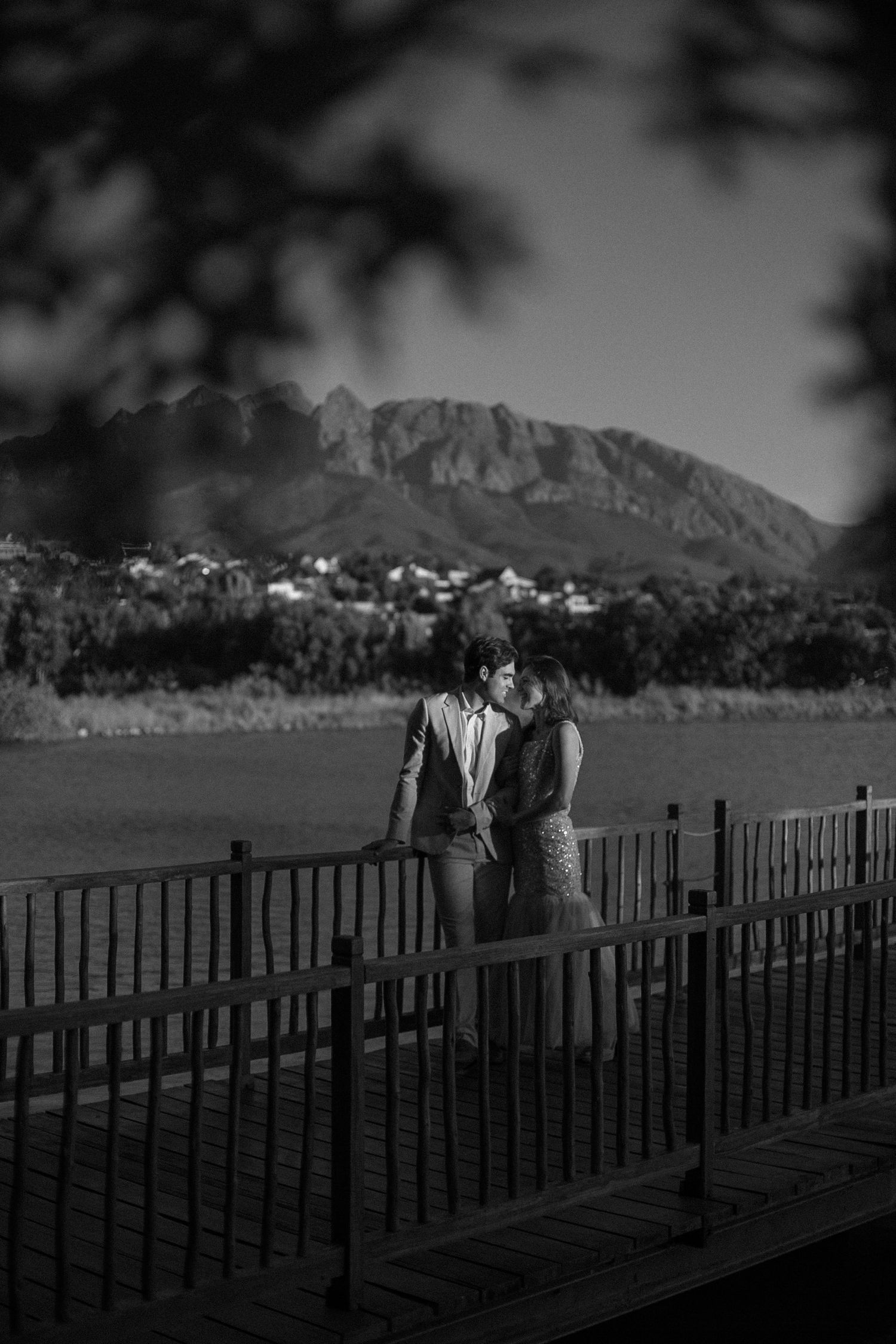 A elopement couple, water in the background