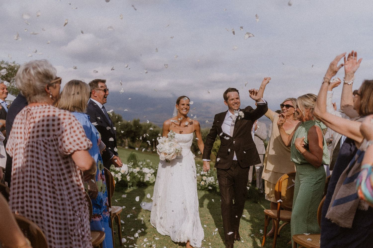 Bride & Groom celebrating with a confetti toss at their home in Somerset West