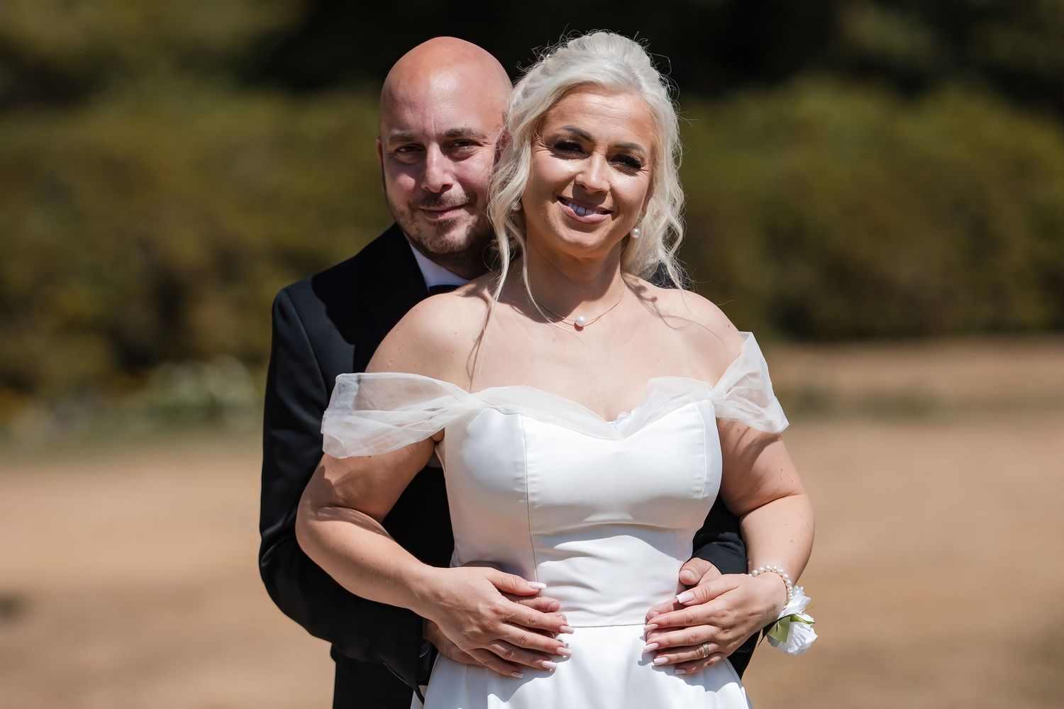 Bride and groom outdoor wedding portrait