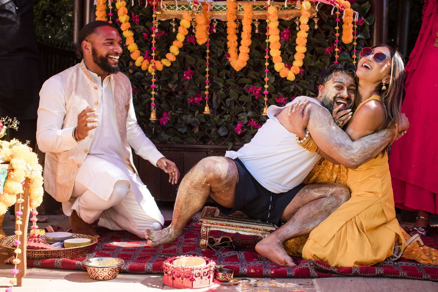 Guests celebrating during a colourful pre-wedding ceremony