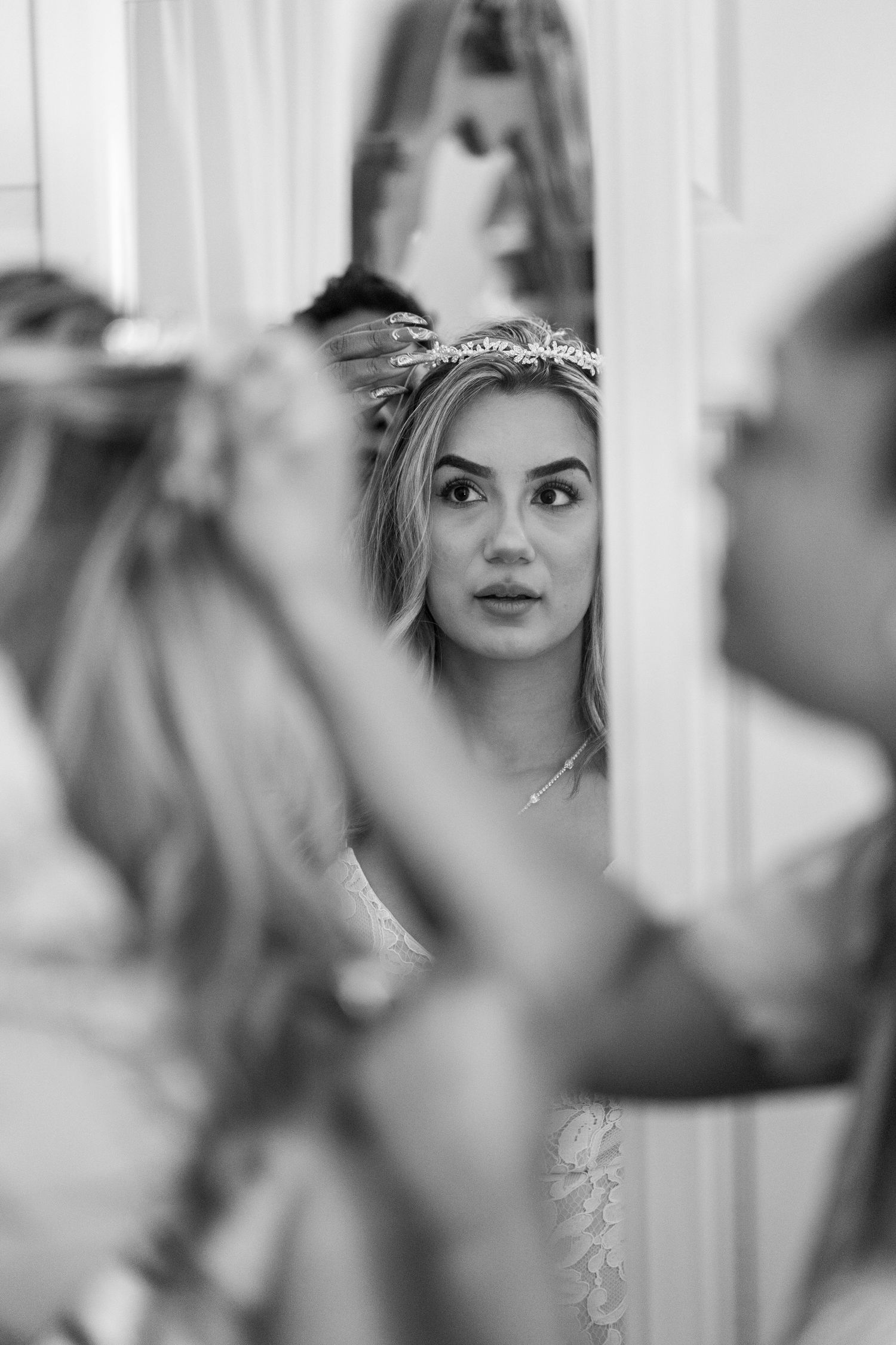 Bride getting ready and having her hair done before wedding ceremony, Sacramento wedding prep captured by The Padillas.