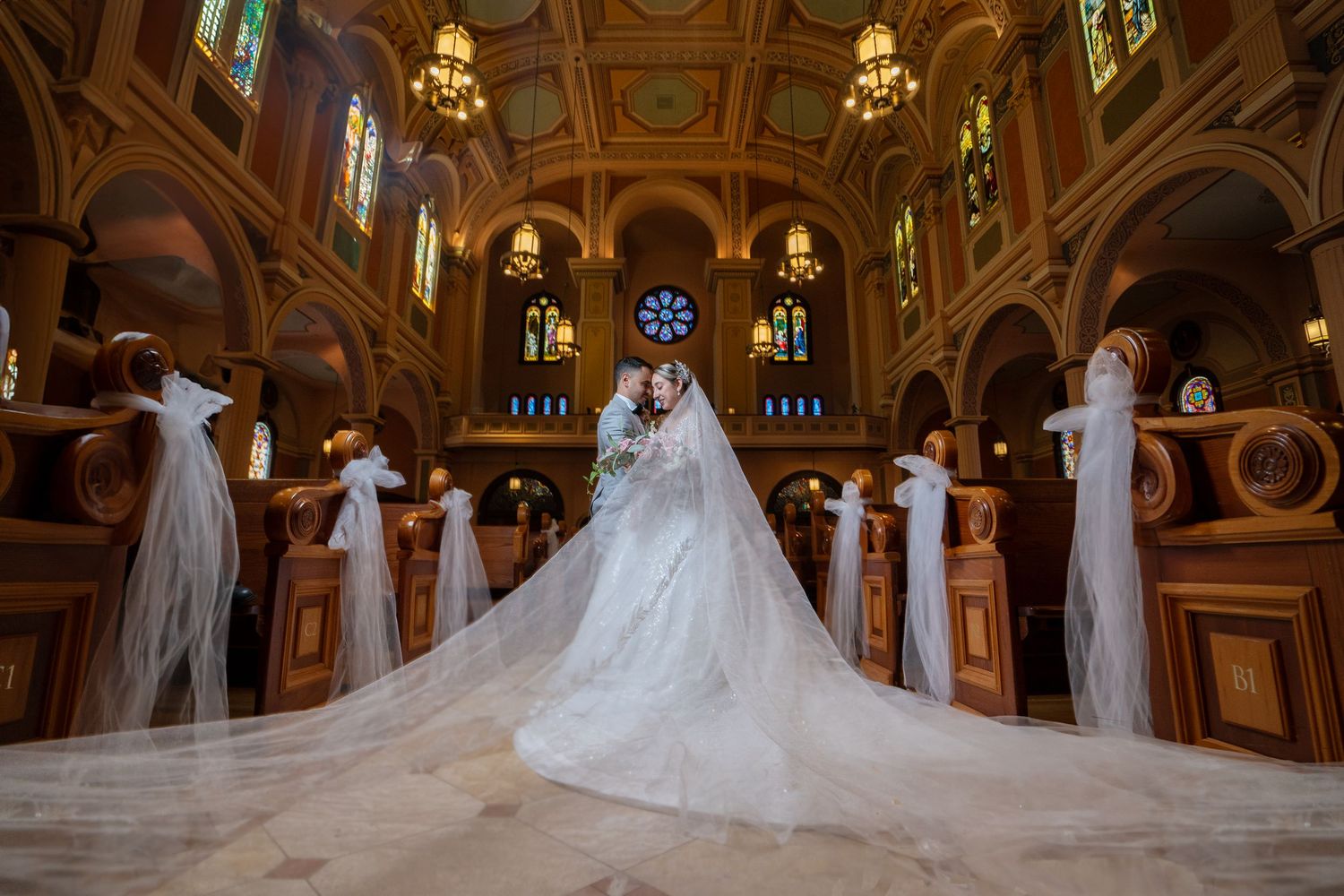 Bride and groom wedding portrait inside Cathedral of the Blessed Sacrament Sacramento, elegant church wedding photography by The Padillas.