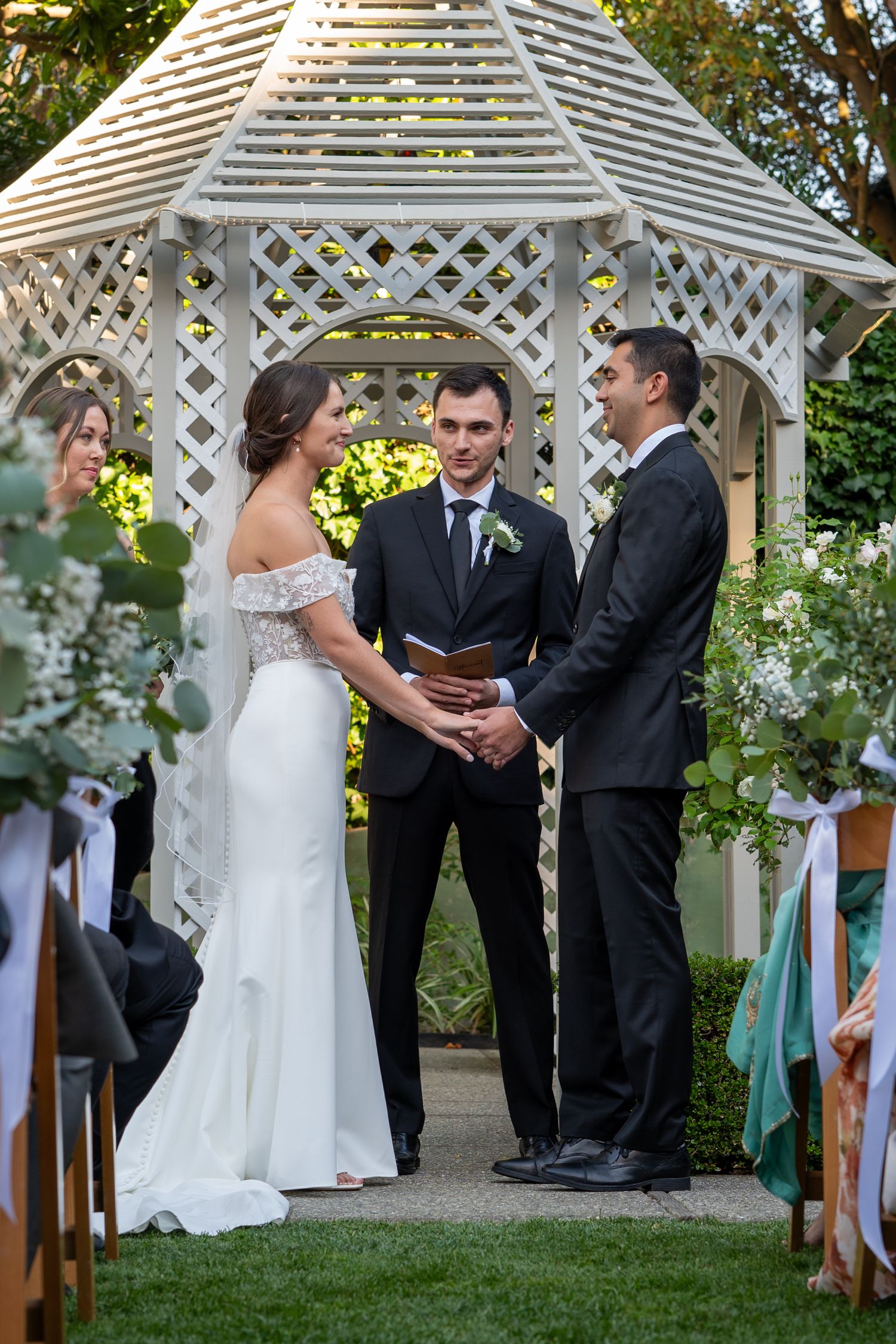 Wedding ceremony at Fay Park, San Francisco, bride and groom exchanging vows under gazebo, The Padillas Wedding Photography.