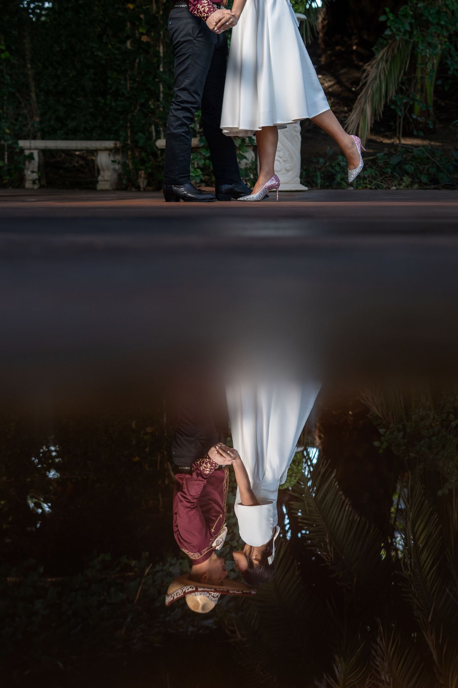 Engagement reflection shot Grand Island Mansion garden courtyard