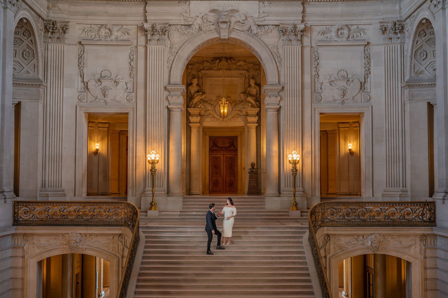 Couple eloping at San Francisco City Hall grand staircase, romantic City Hall elopement photography by The Padillas Studio