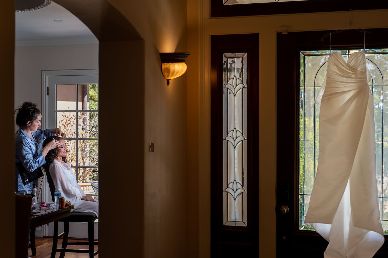 Candid moment of bride getting ready for wedding in Monterey captured by The Padillas documentary photographers.