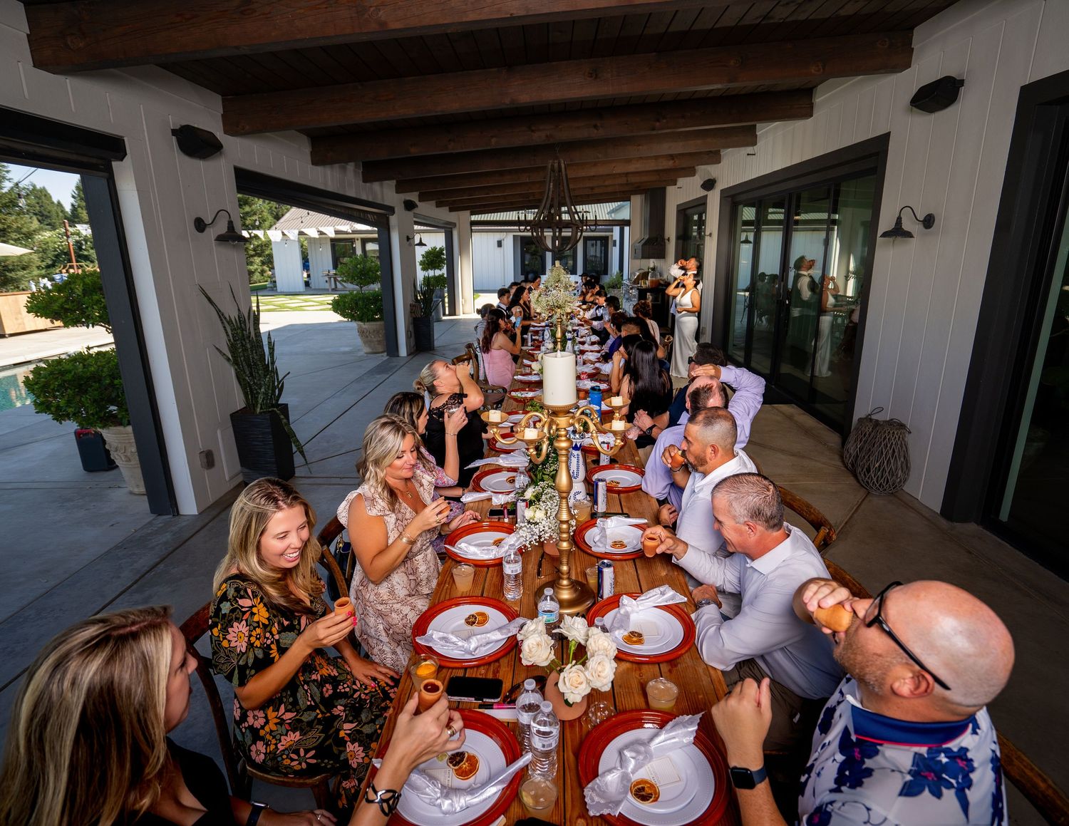 Intimate dinner at The Ranch at Lone Oak, candid documentary wedding photo by The Padillas.