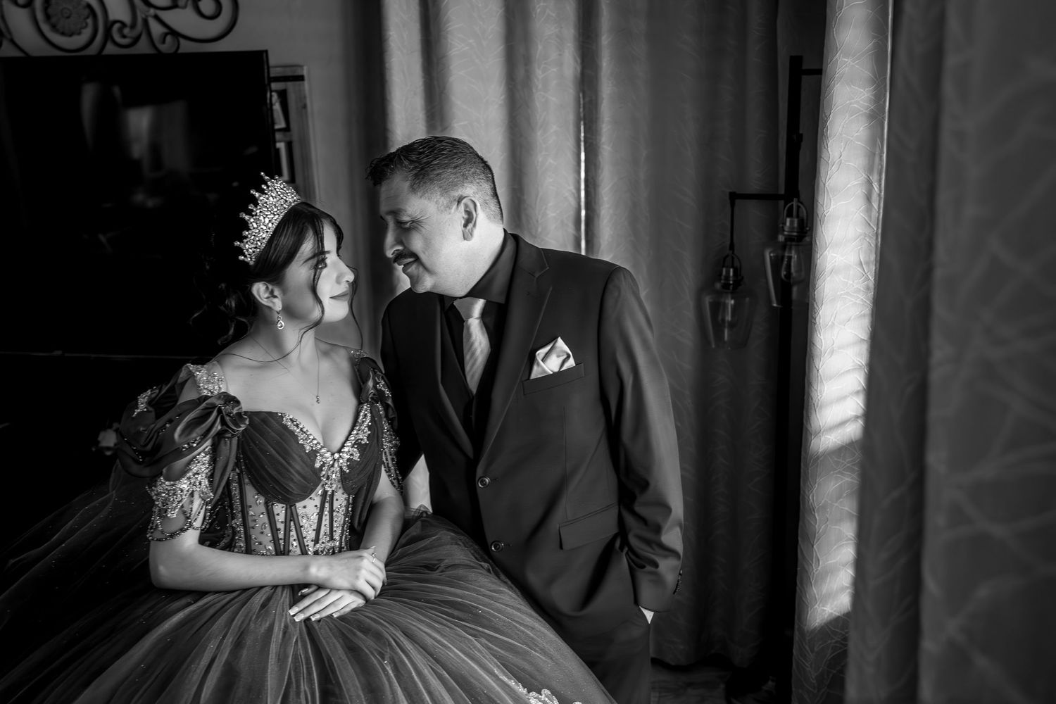 Editorial quinceañera in dramatic luxury portrait session, high‑end lighting and cinematic styling