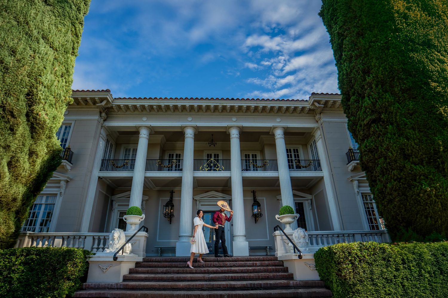 Couple dancing in front of Grand Island Mansion, luxury elopement portrait at Sacramento’s premier estate venue by The Padillas